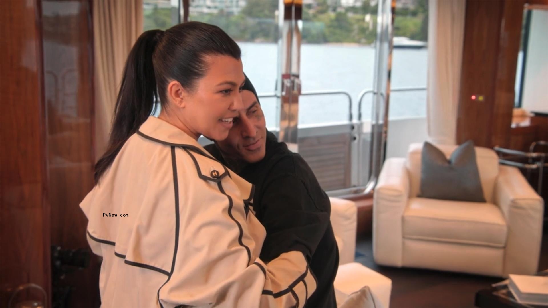 Kourtney Kardashian and Travis Barker showing PDA on a yacht. 