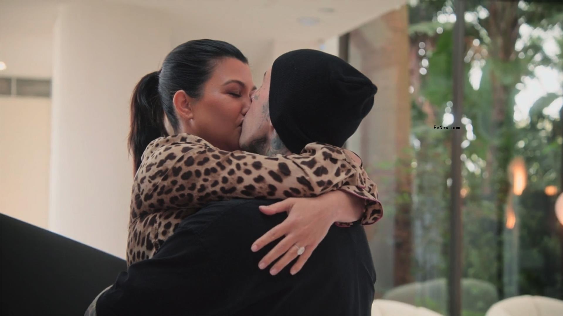 Kourtney Kardashian and Travis Barker making out on a yacht. 