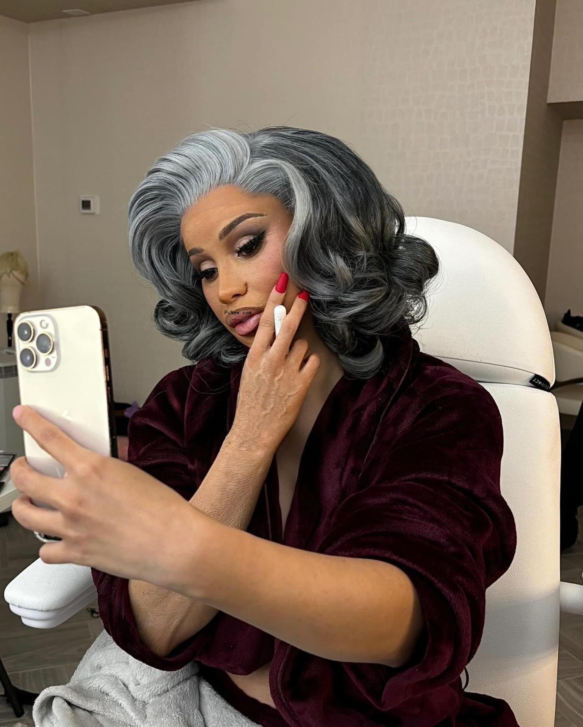Cardi B taking a selfie. 