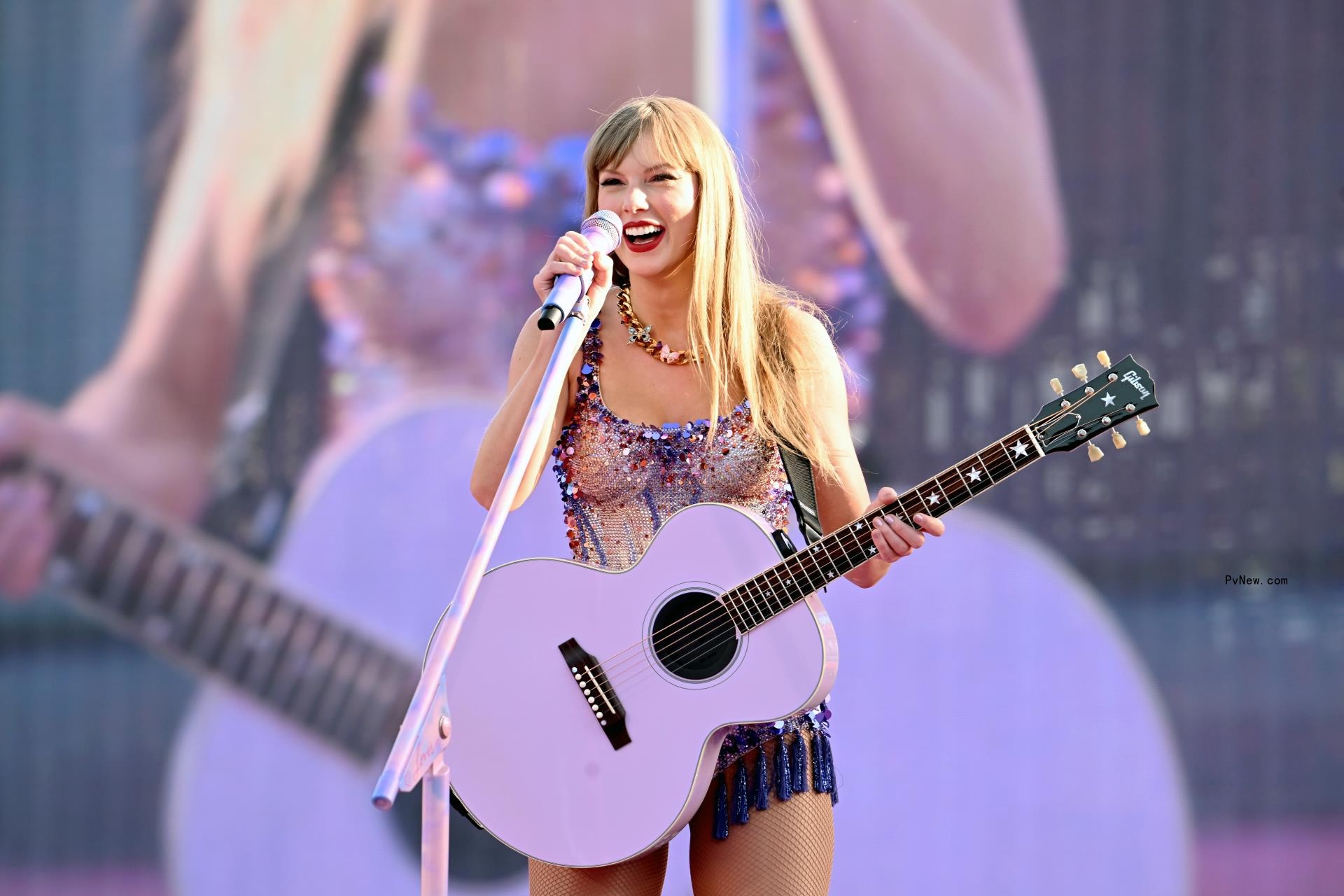 Taylor Swift performing on stage.