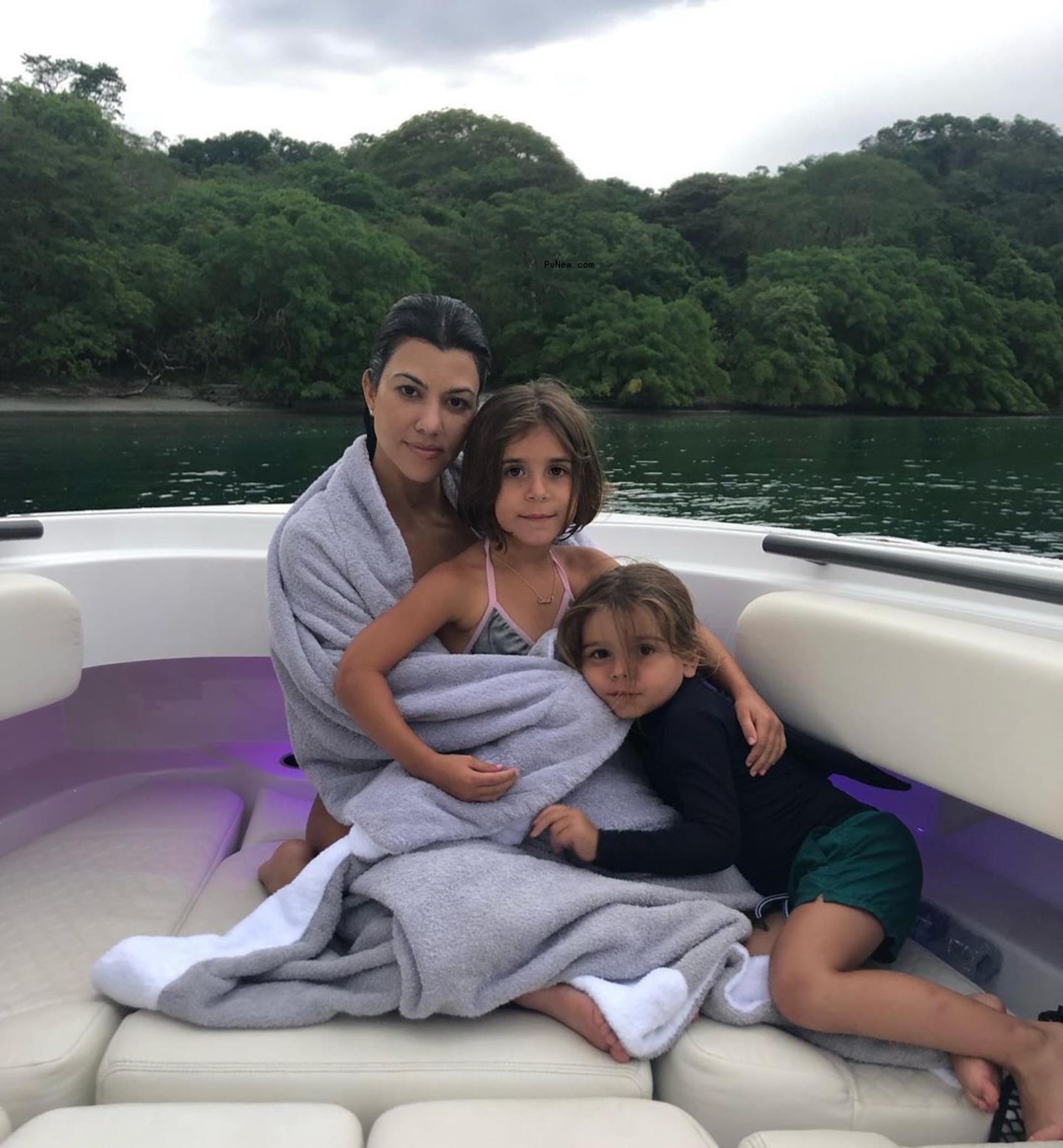 Kourtney Kardashian posed with Penelope and Reign.