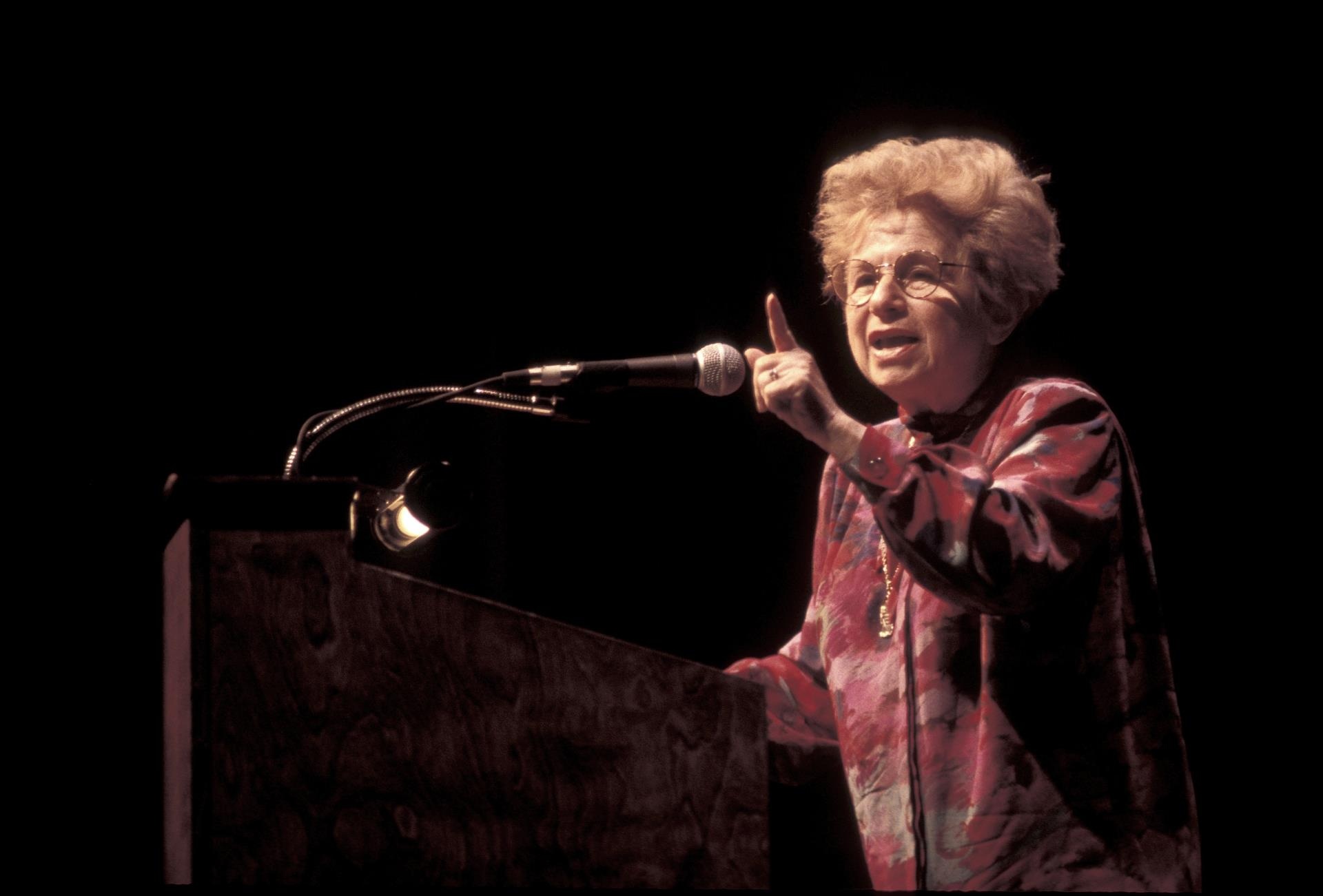 Dr. Ruth Westheimer speaking at a lecture.