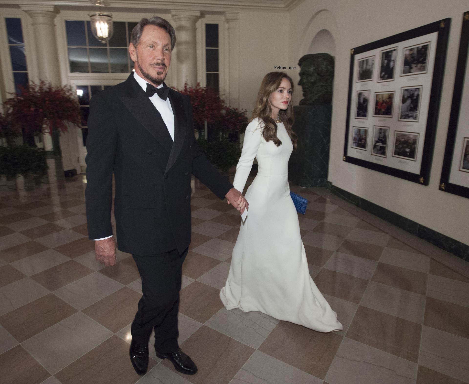 Nikita Kahn and Larry Ellison walking together