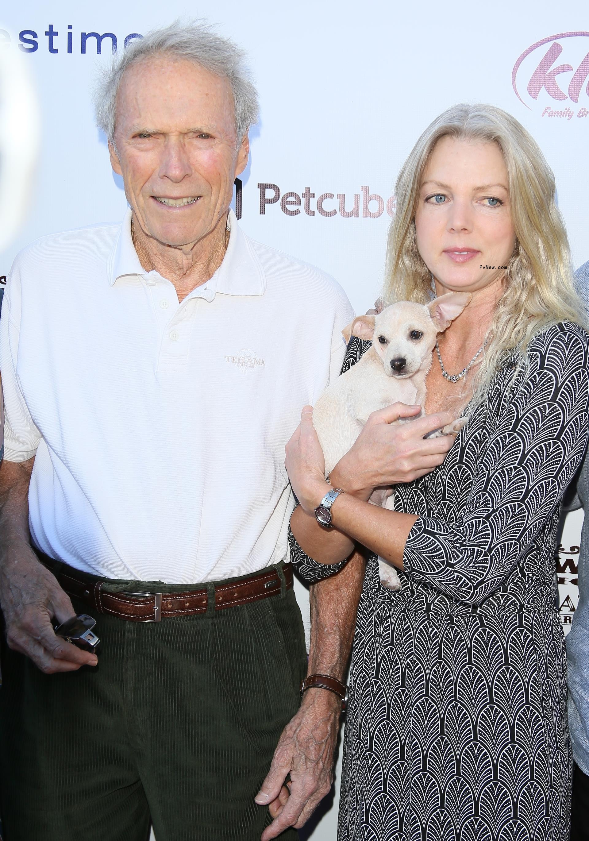 clint eastwood and christina sandera who is holding her dog