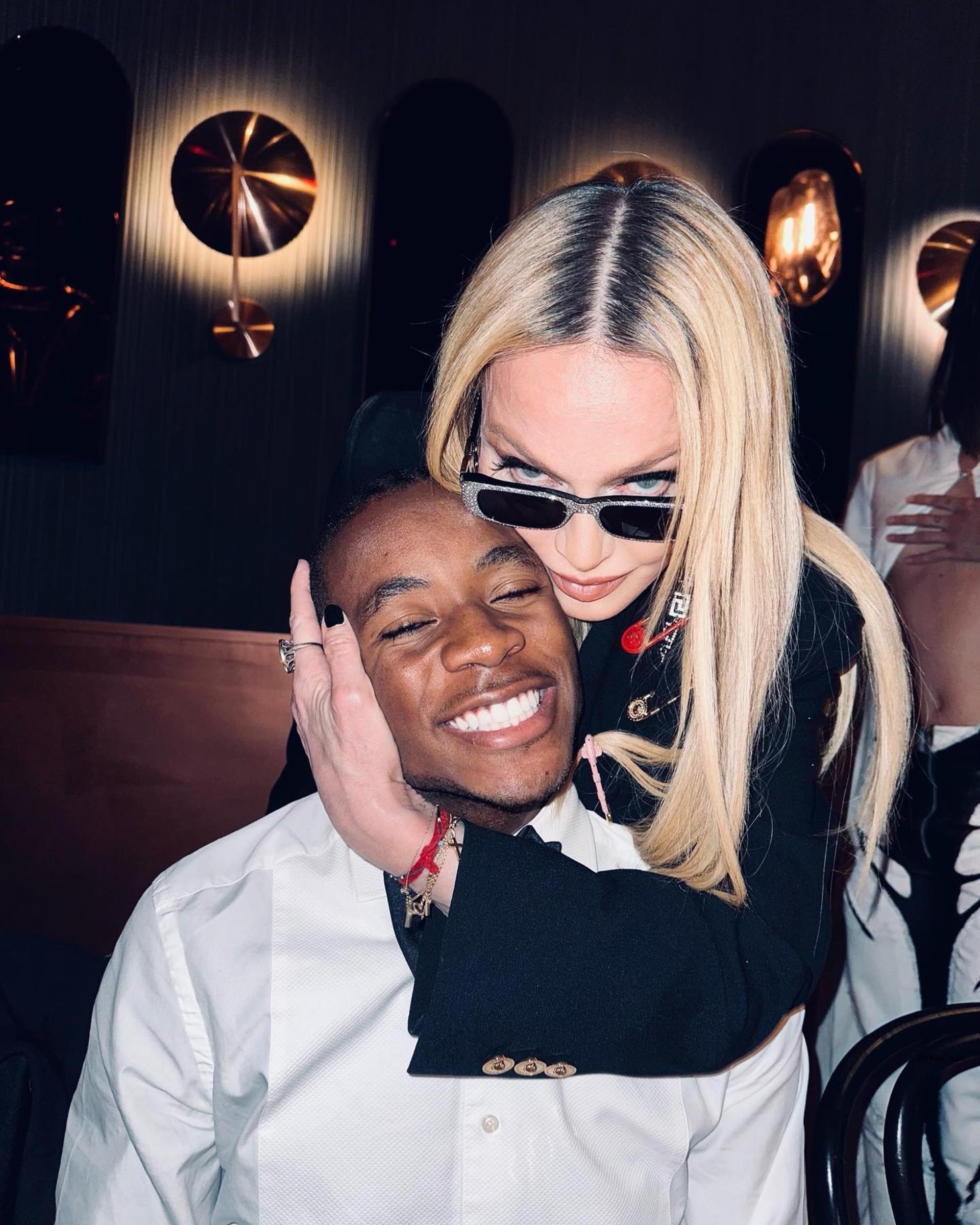 mado<i></i>nna hugging son david banda from behind