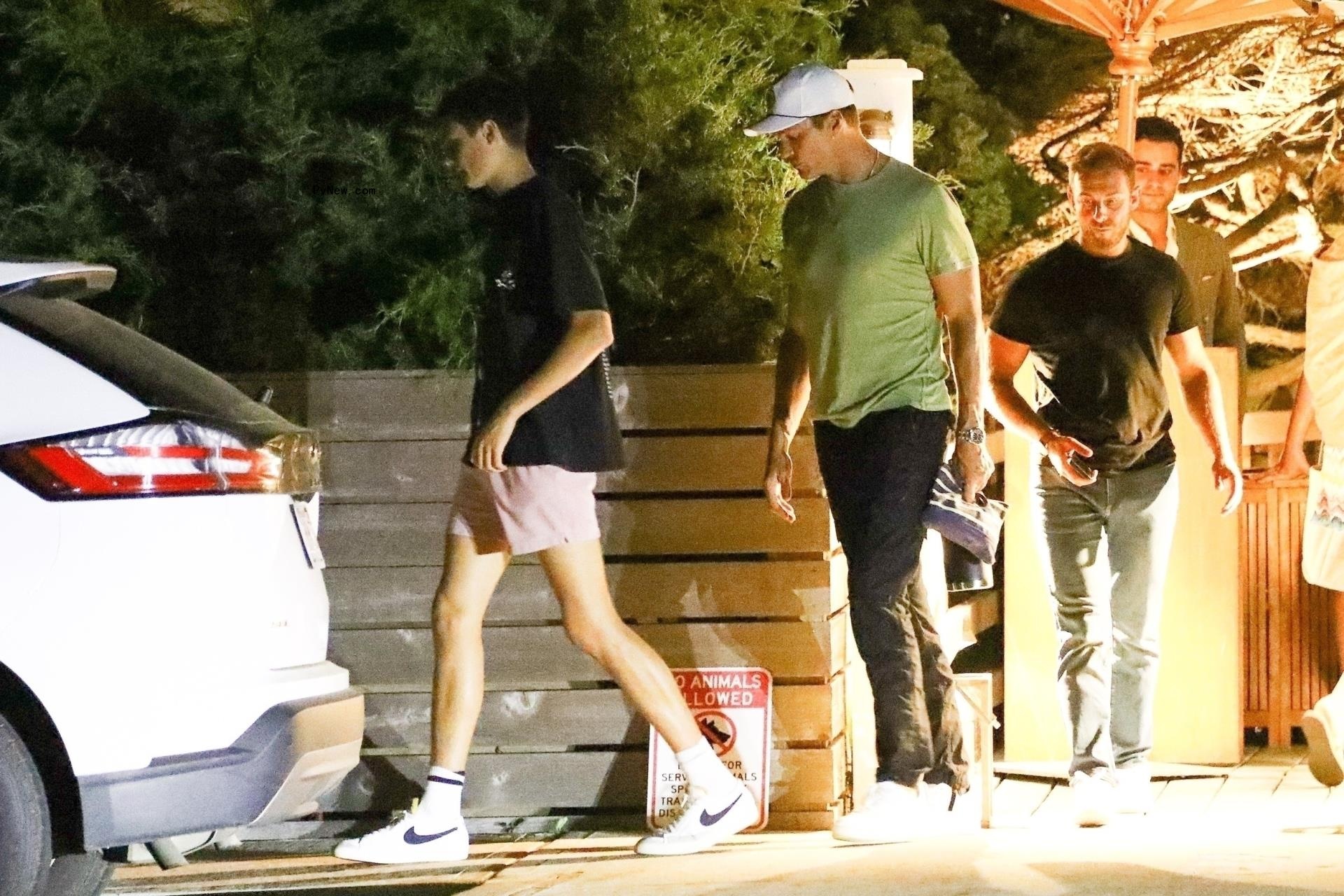 tom brady and his son jack walking to their car