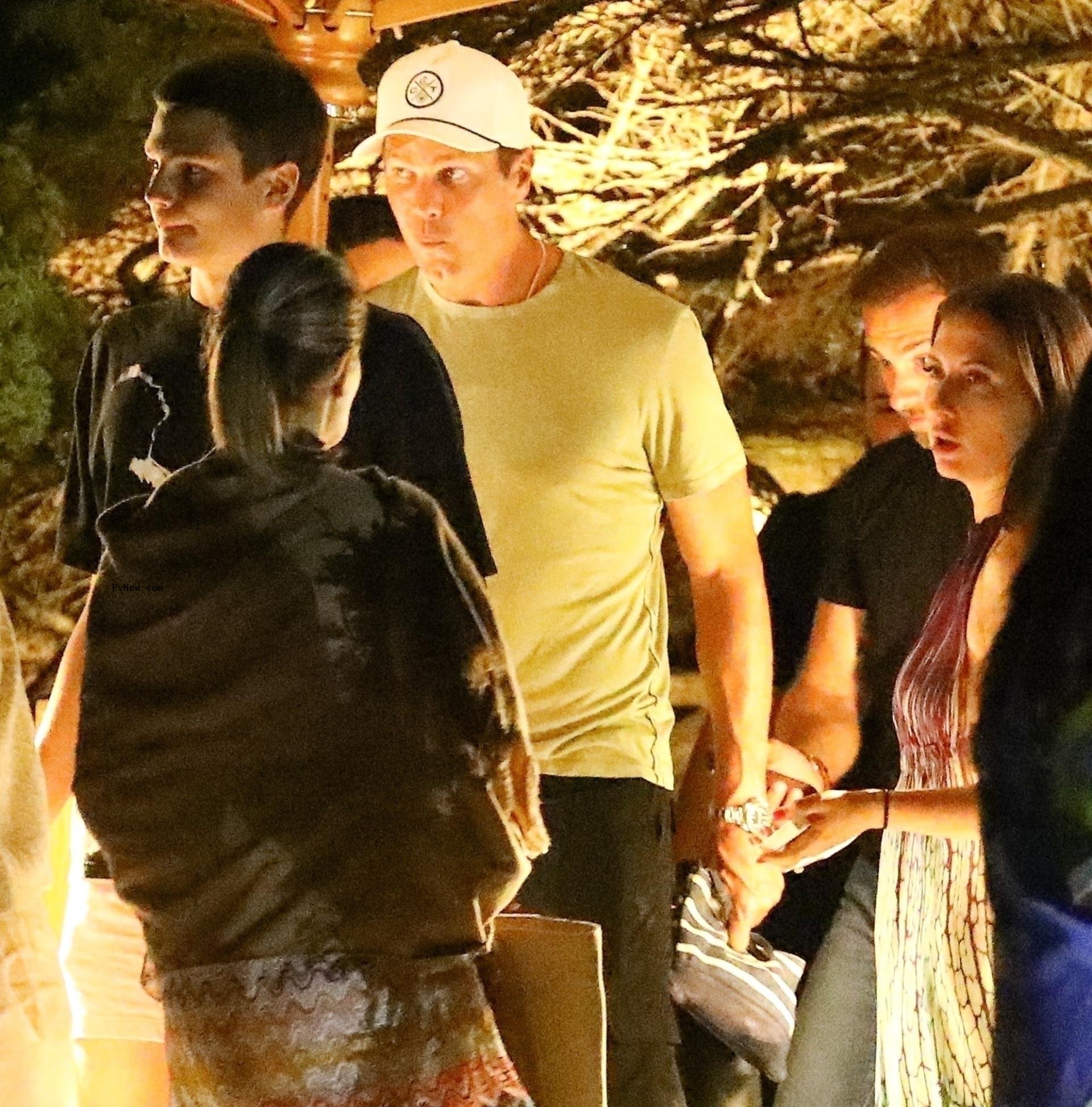 tom brady walking out of a restaurant with his son jack
