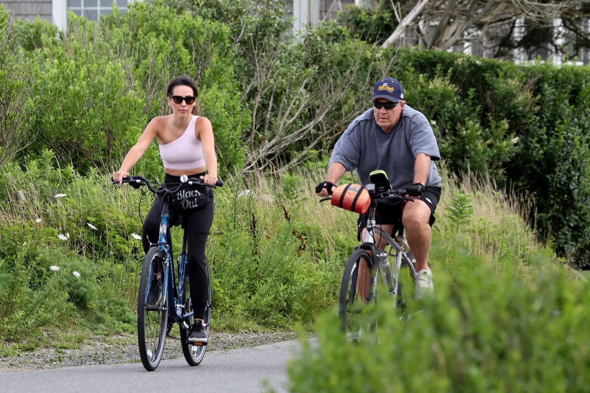 Bill Belichick and Jordon Hudson riding bikes in Nantucket. 