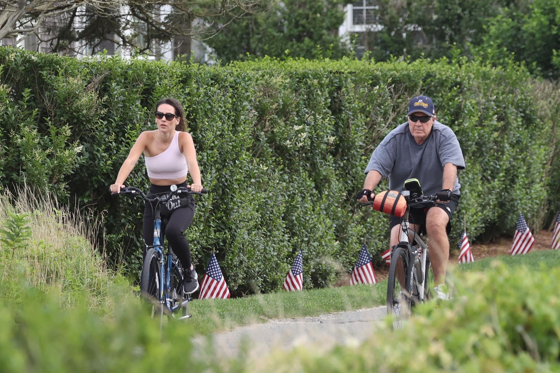Bill Belichick and Jordon Hudson riding bikes in Nantucket. 