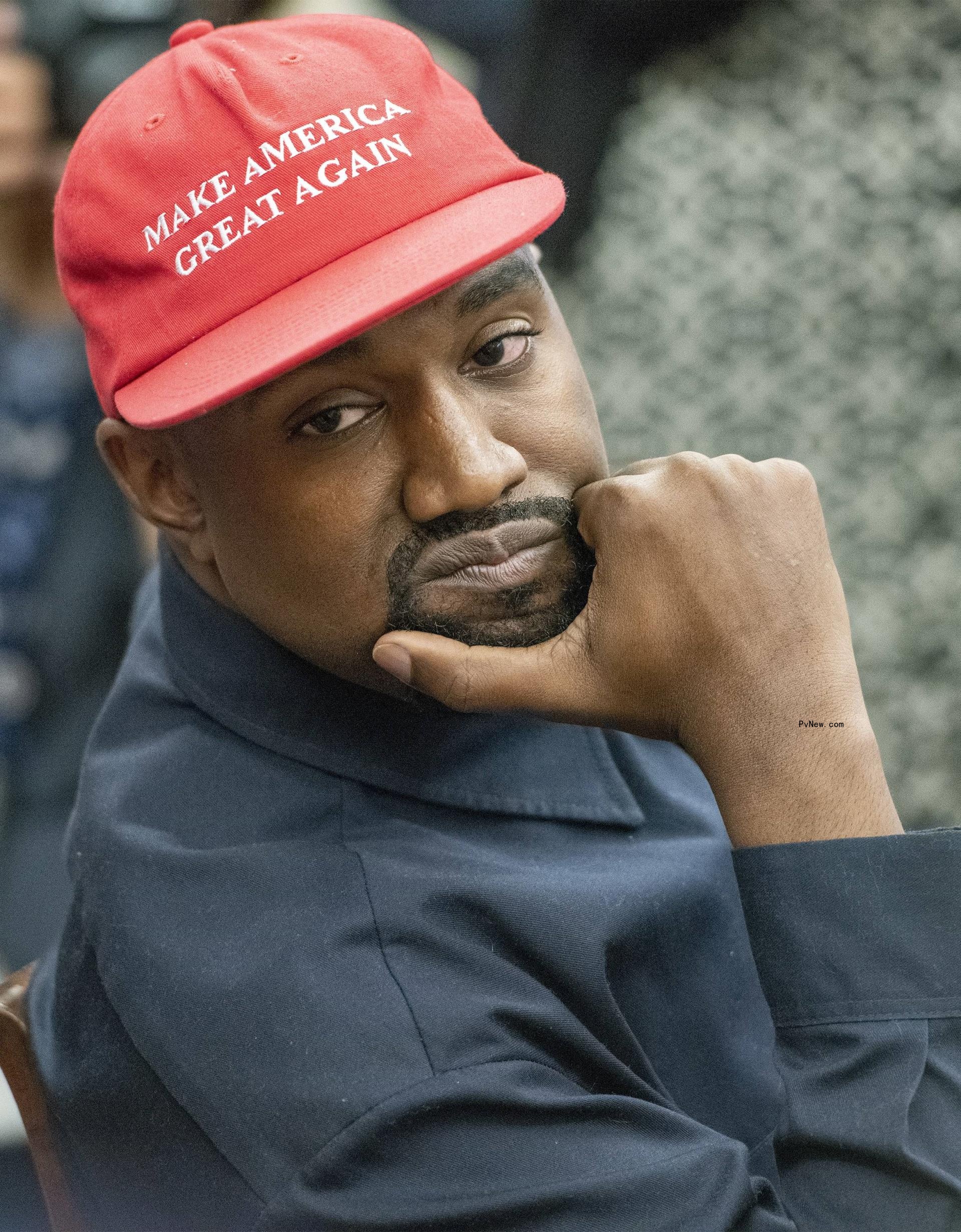 Kanye West wearing a red 