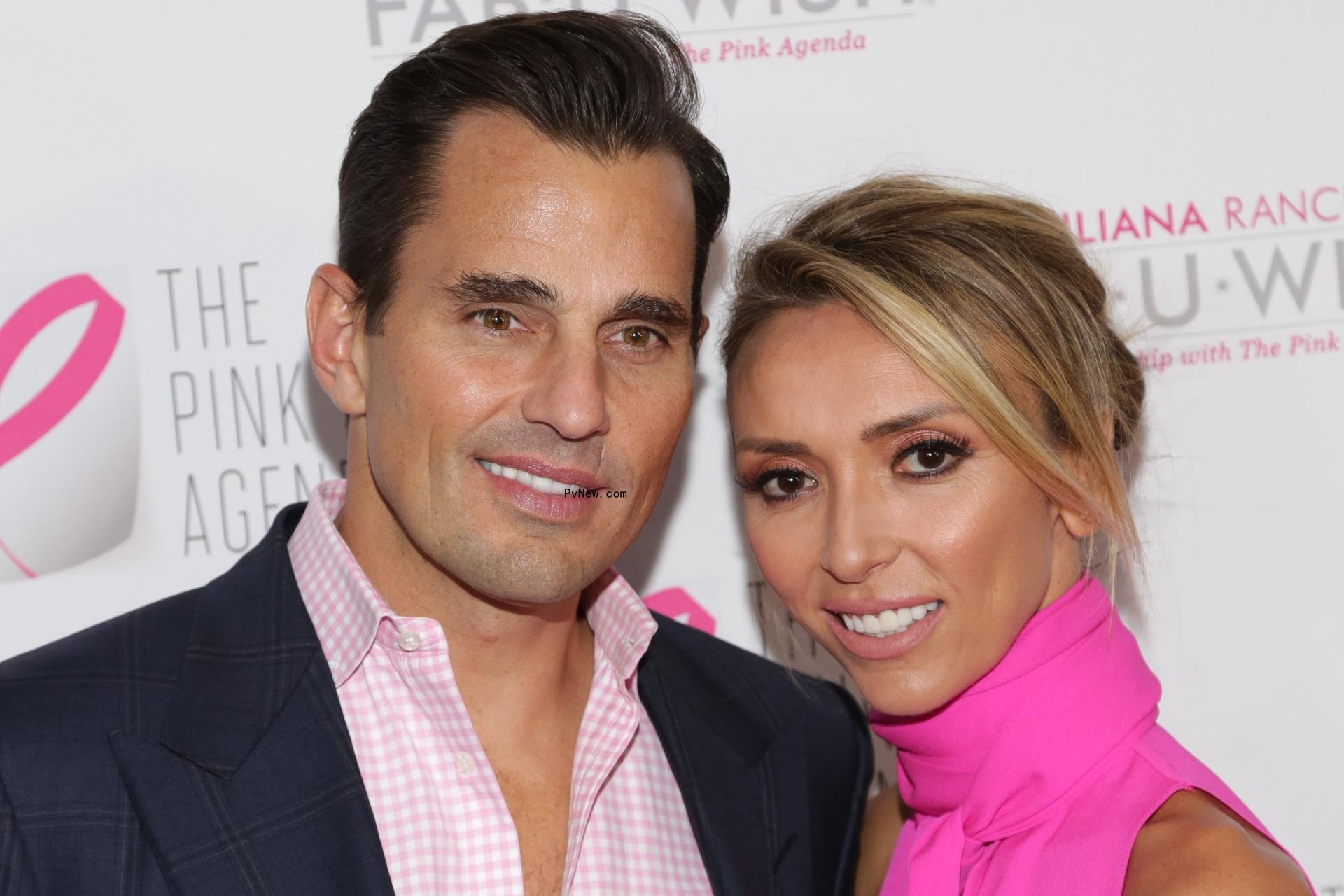 bill rancic sitting in an office