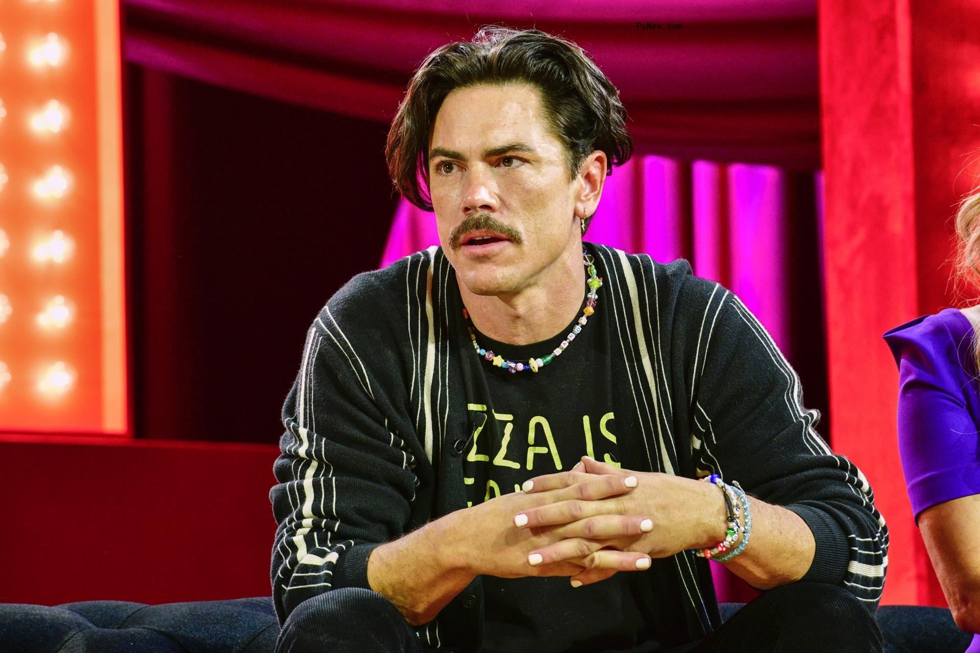 Tom Sandoval sitting