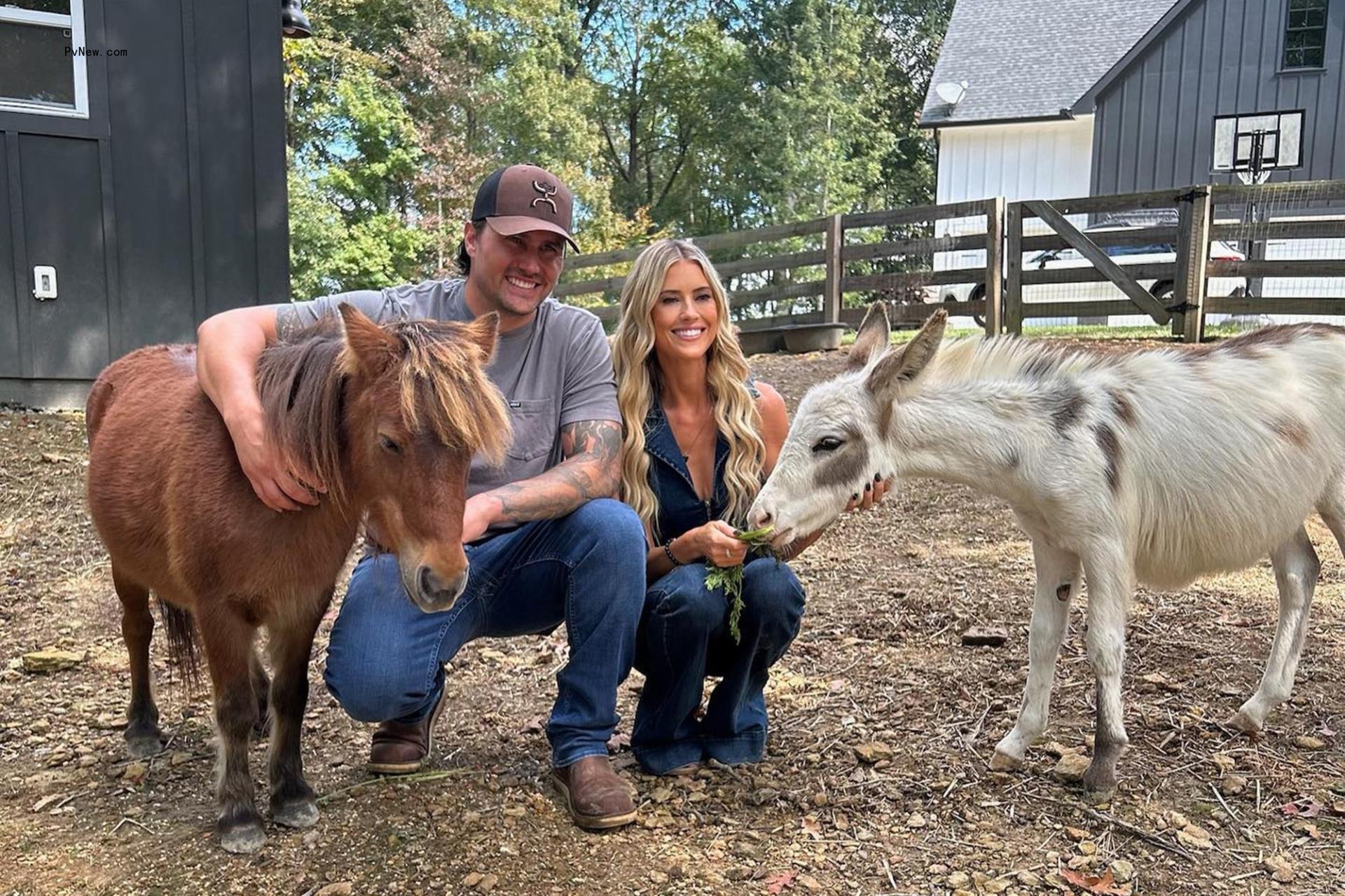 christina hall and josh hall playing with donkeys