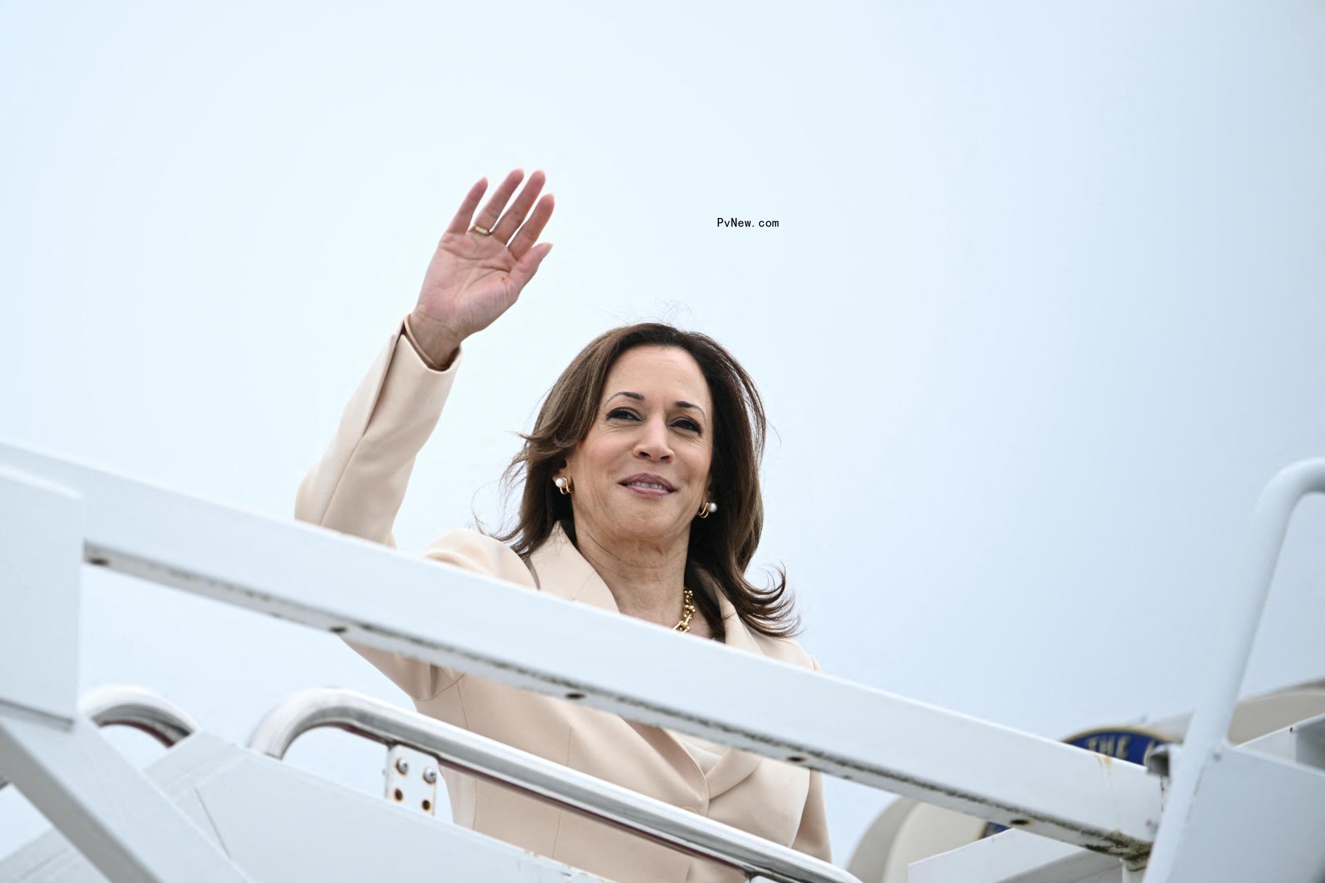 Kamala Harris standing and waving outside