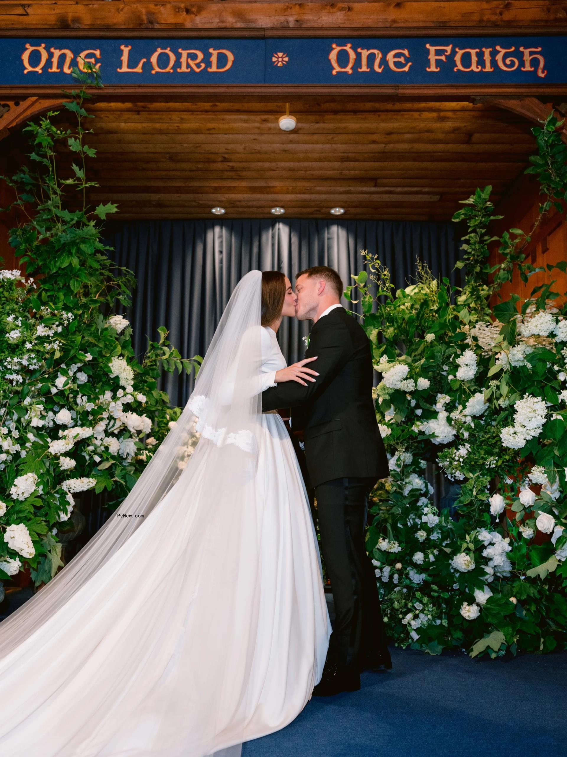 Olivia Culpo and Christian McCaffrey at the altar.