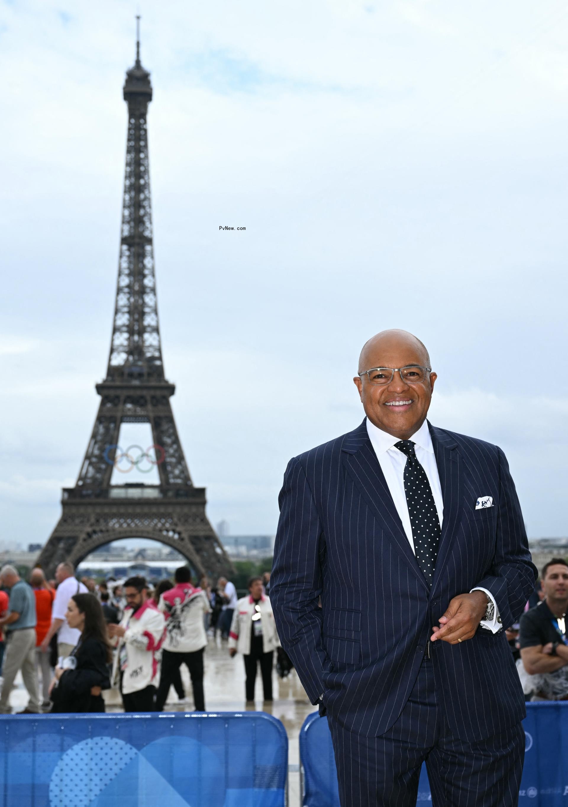 Mike Tirico smiles at the opening ceremony of the 2024 Olympic Games in Paris 
