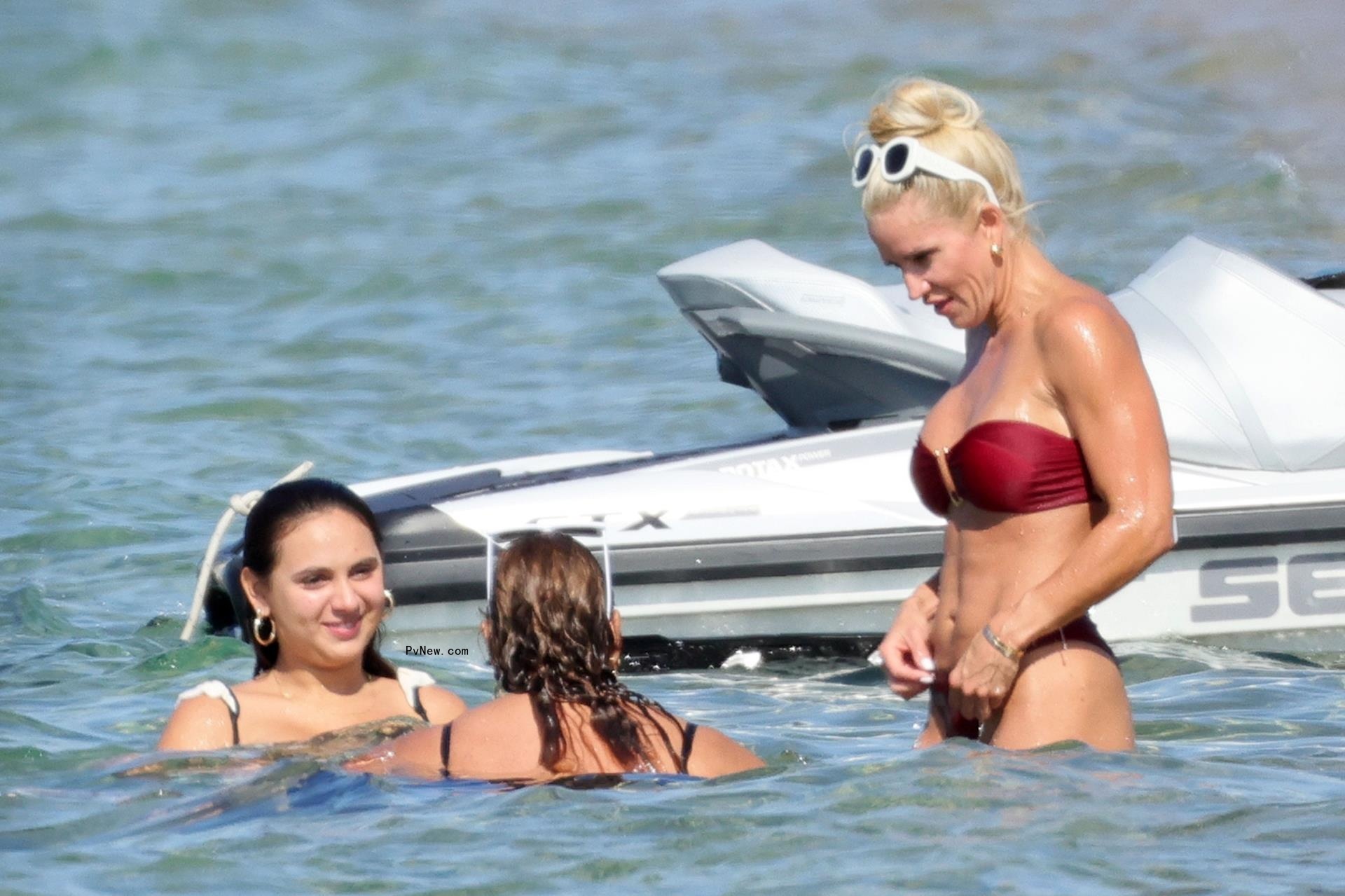 Jaclyn Cordeiro taking a dip in Sardinia with Alex Rodriguez's daughters.