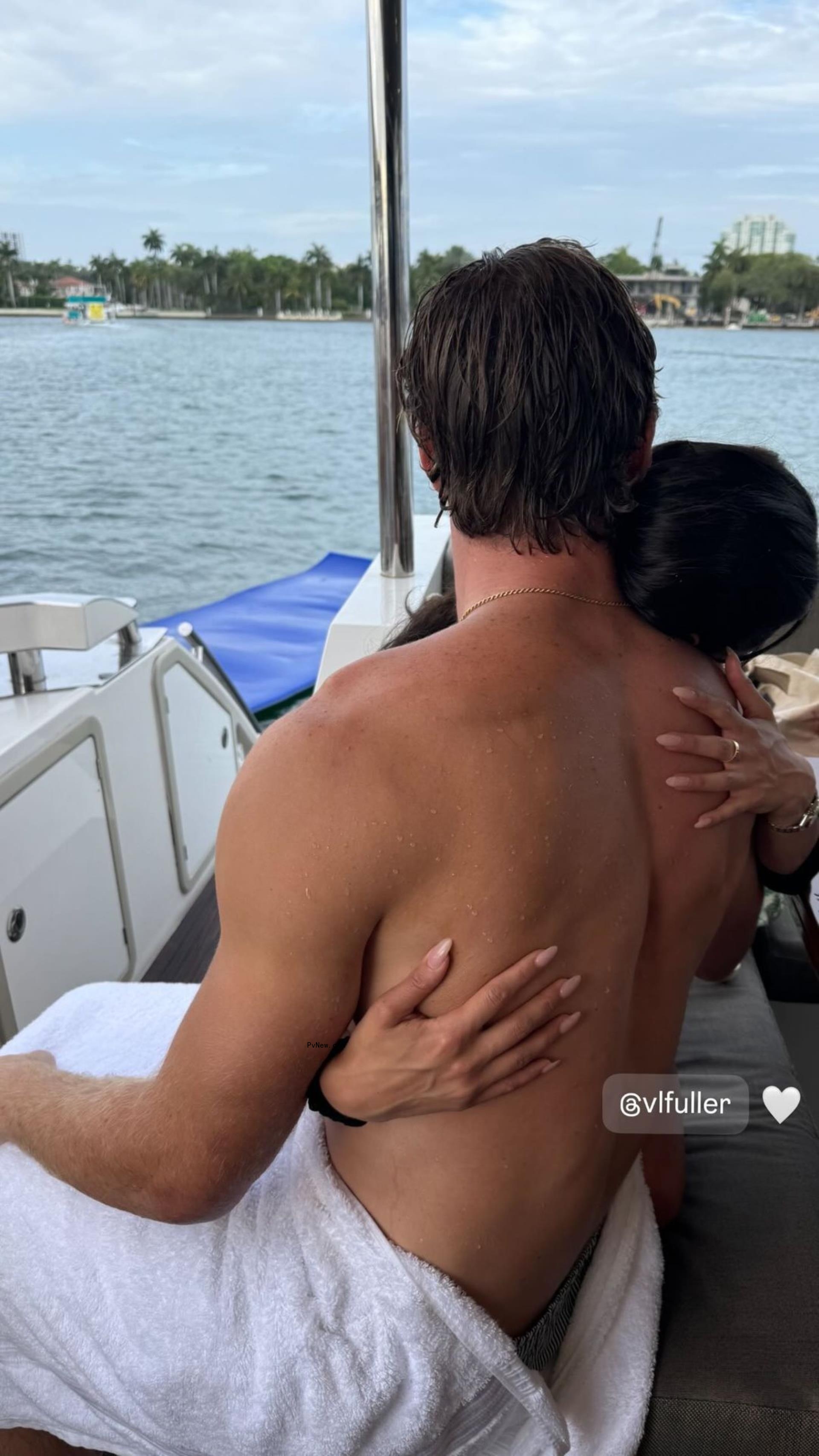 Victoria Fuller hugging a shirtless Will Levis on a boat.