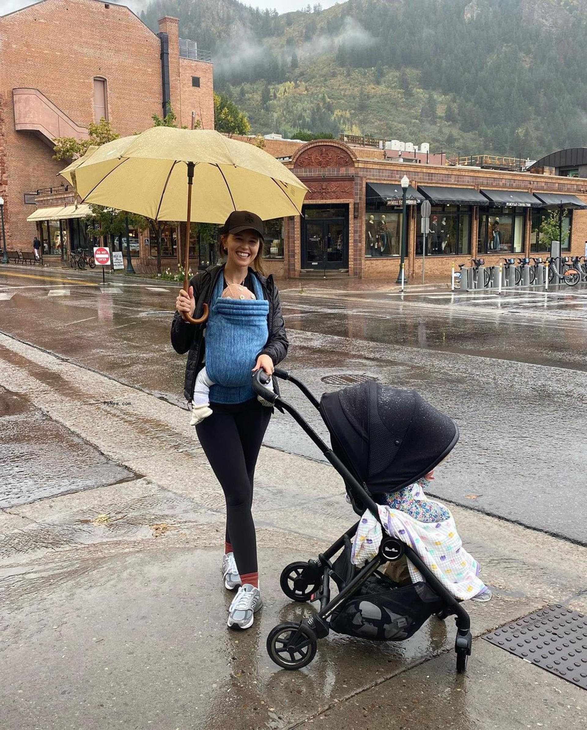 Schwarzenegger holds her daughter and pushes the other in an Instagram photo.
