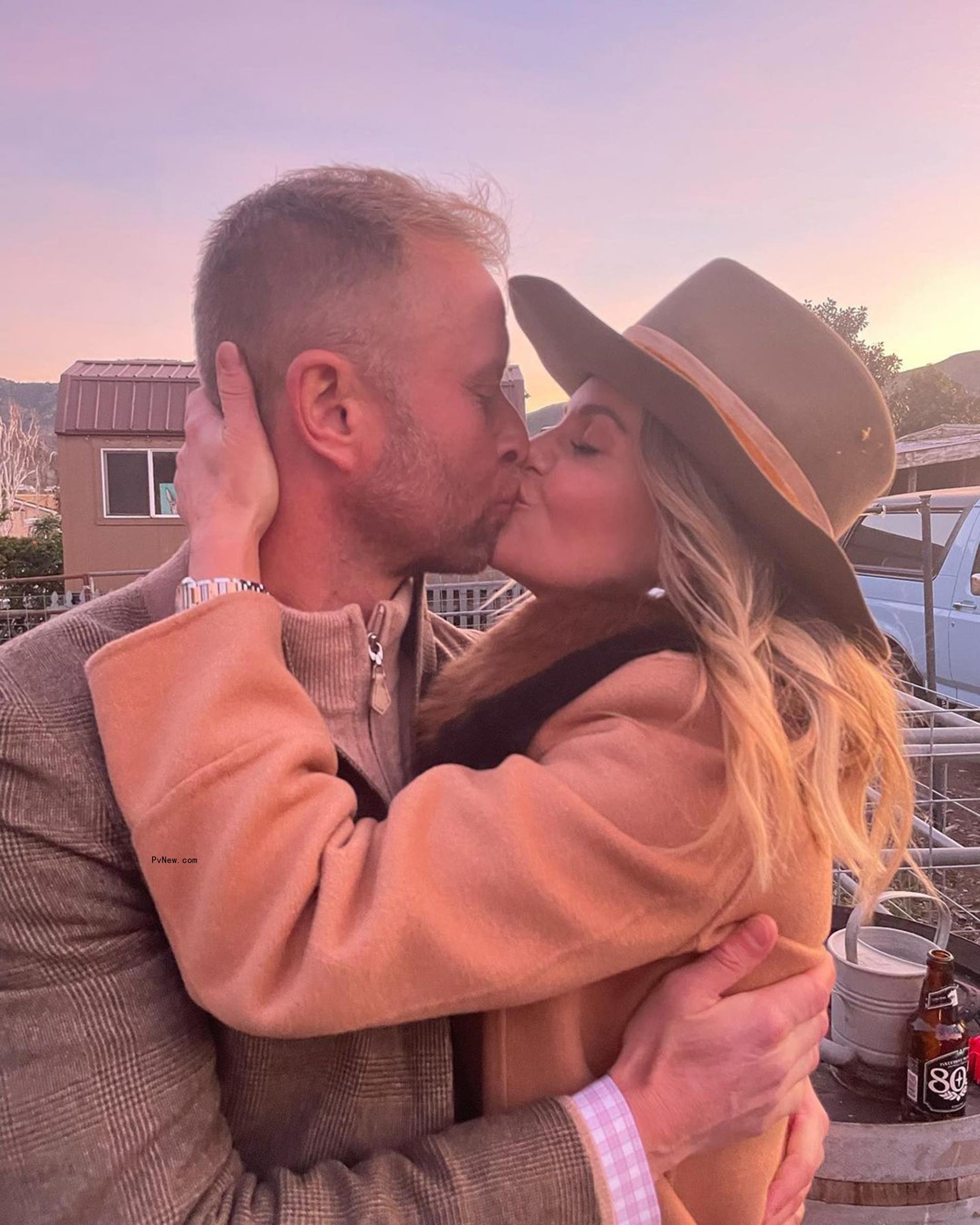 Candace Cameron Bure kisses husband Val Bure in an Instagram photo.