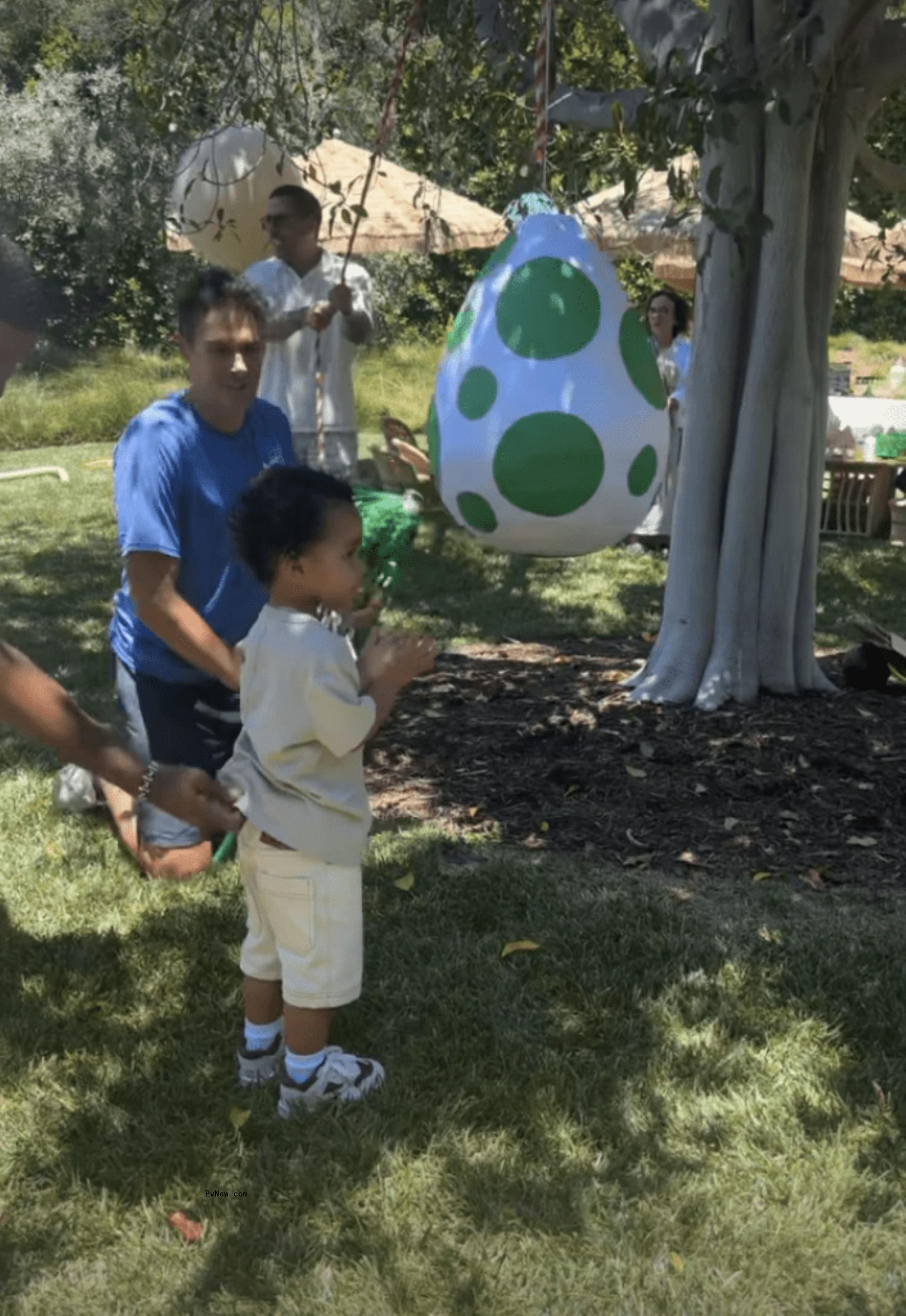 Tatum Thompson hitting a piñata 2nd birthday party on July 28, 2024