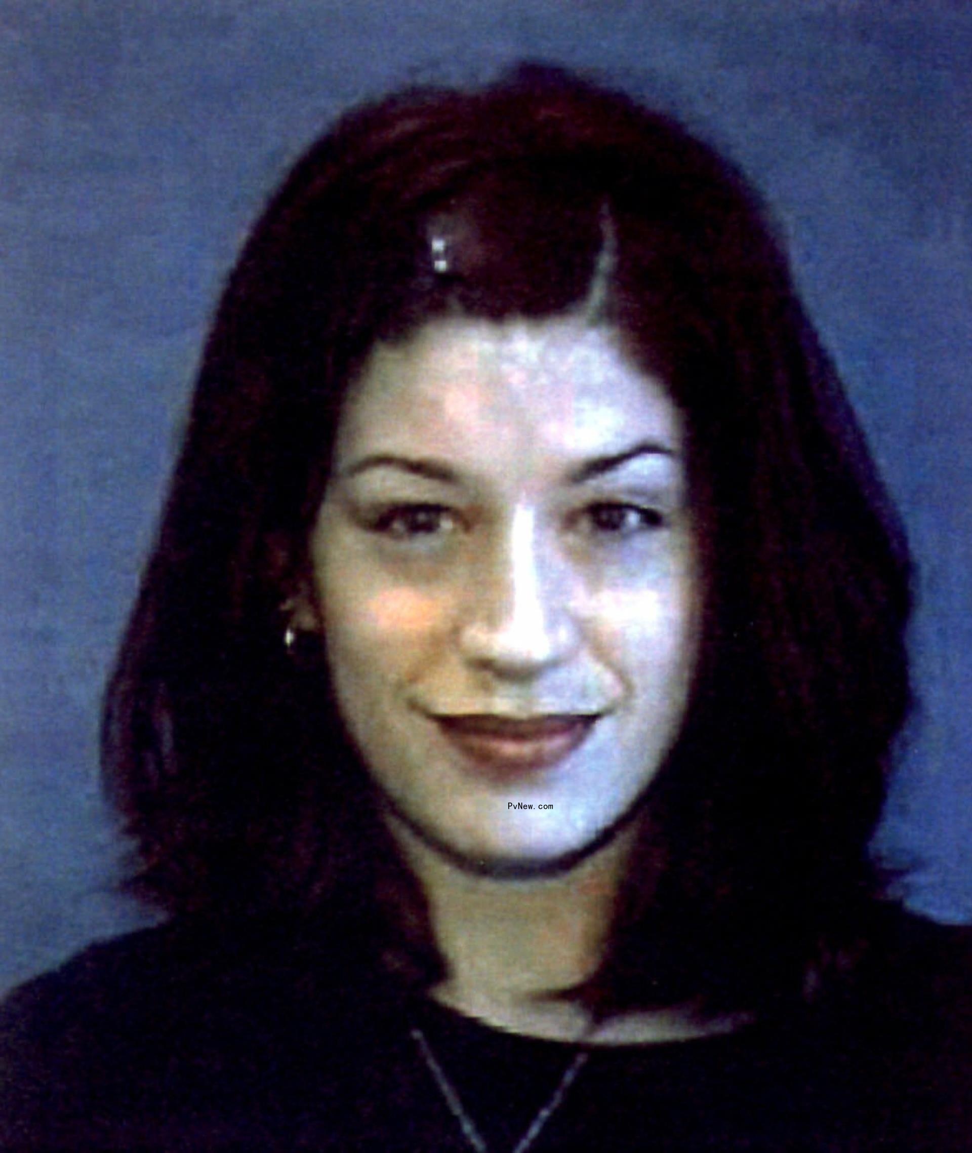 Jennifer Syme DMV headshot with blue background.