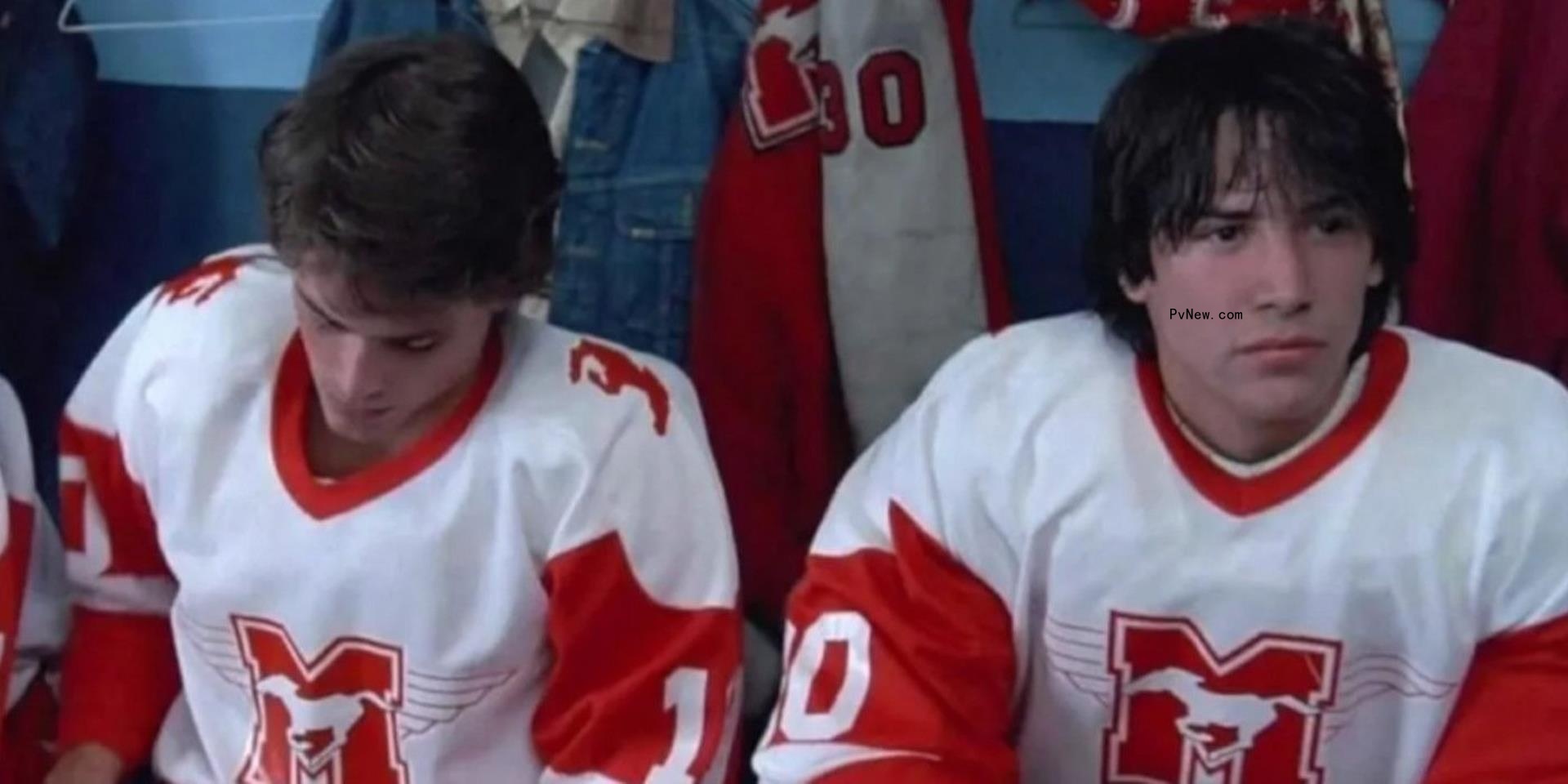 Rob Lowe (left) and Keanu Reeves in hockey uniforms in a still from