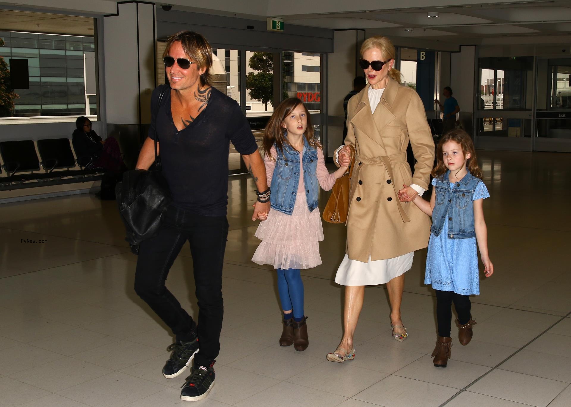 Keith Urban, Nicole Kidman and their daughters, Sunday and Faith, at the airport in 2017