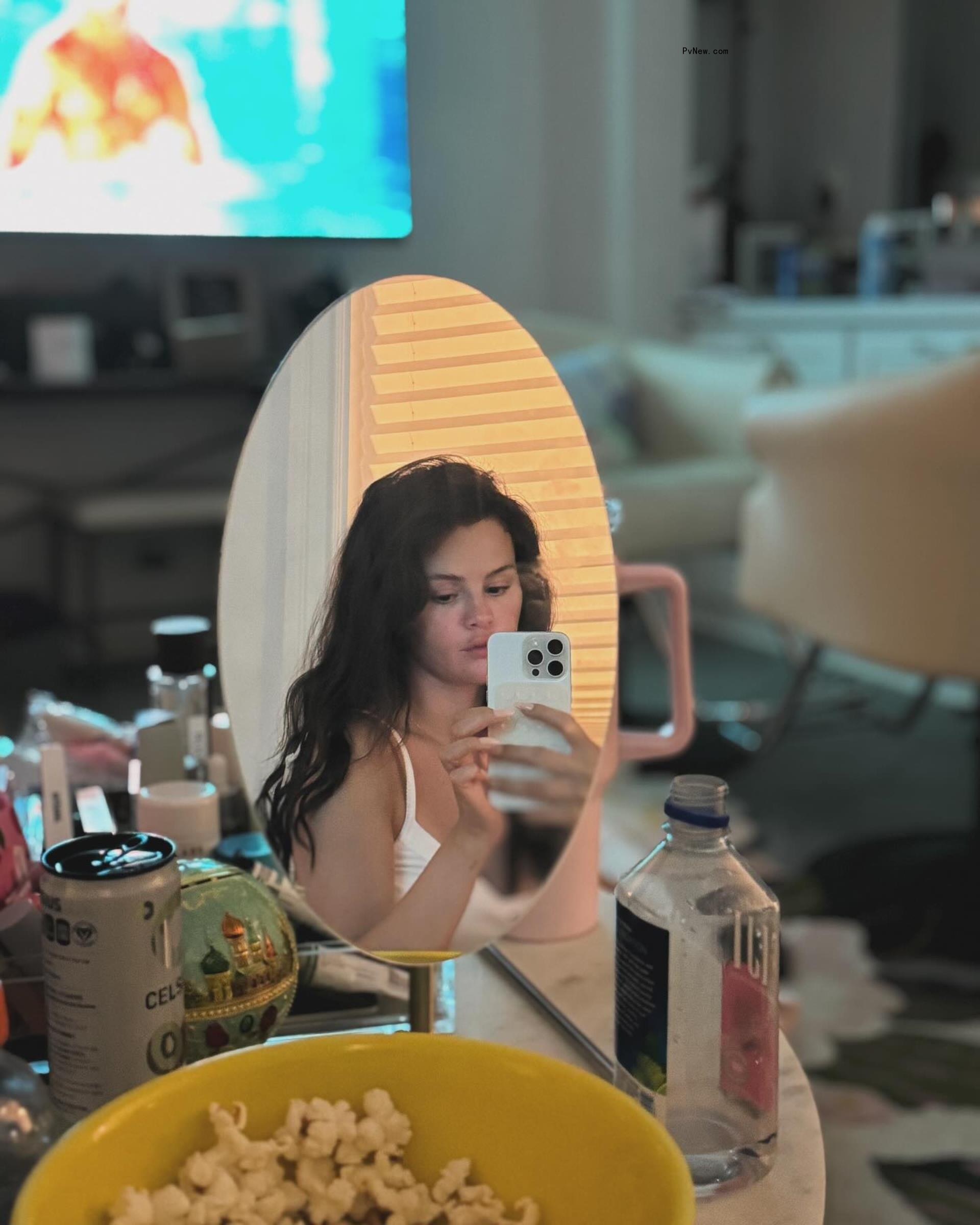 Selena Gomez taking a mirror selfie.