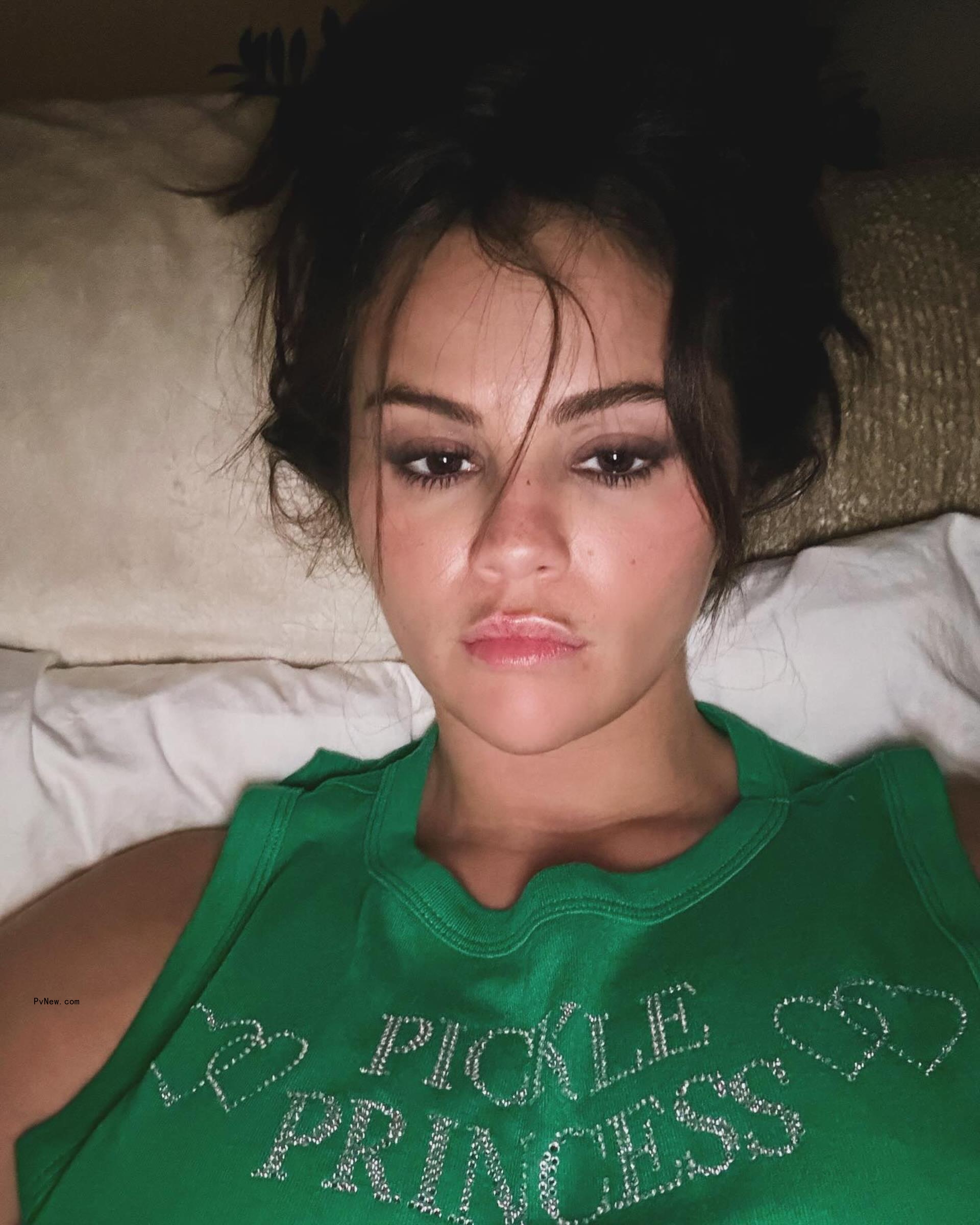 Selena Gomez in a green shirt.
