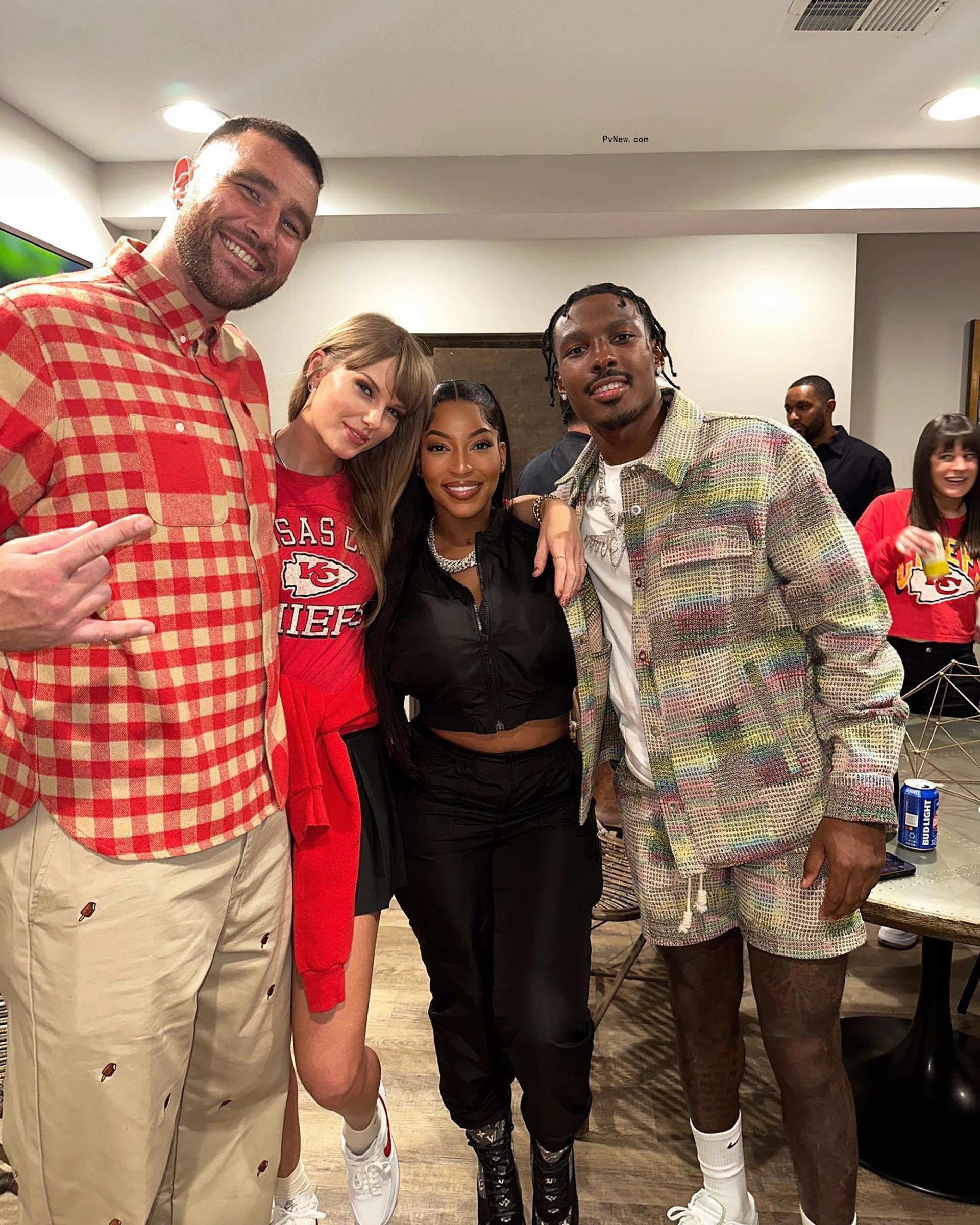 Taylor Swift and Travis Kelce with friends in Travis Kelce's suite at Arrowhead Stadium. 