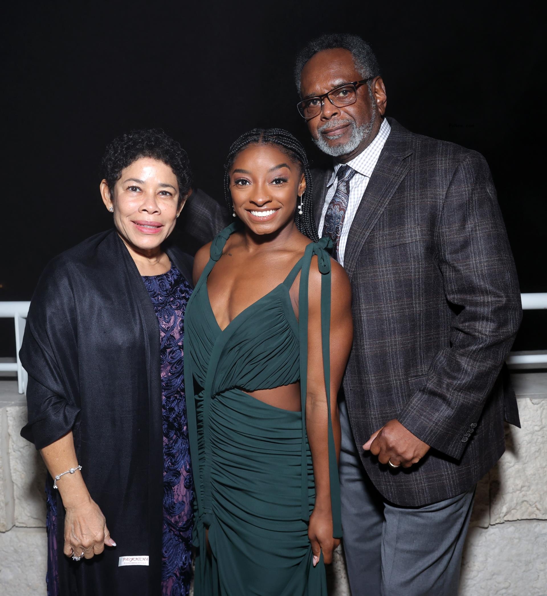 Simone Biles and her parents, Nellie Biles and Ro<i></i>nald Biles, in 2021.
