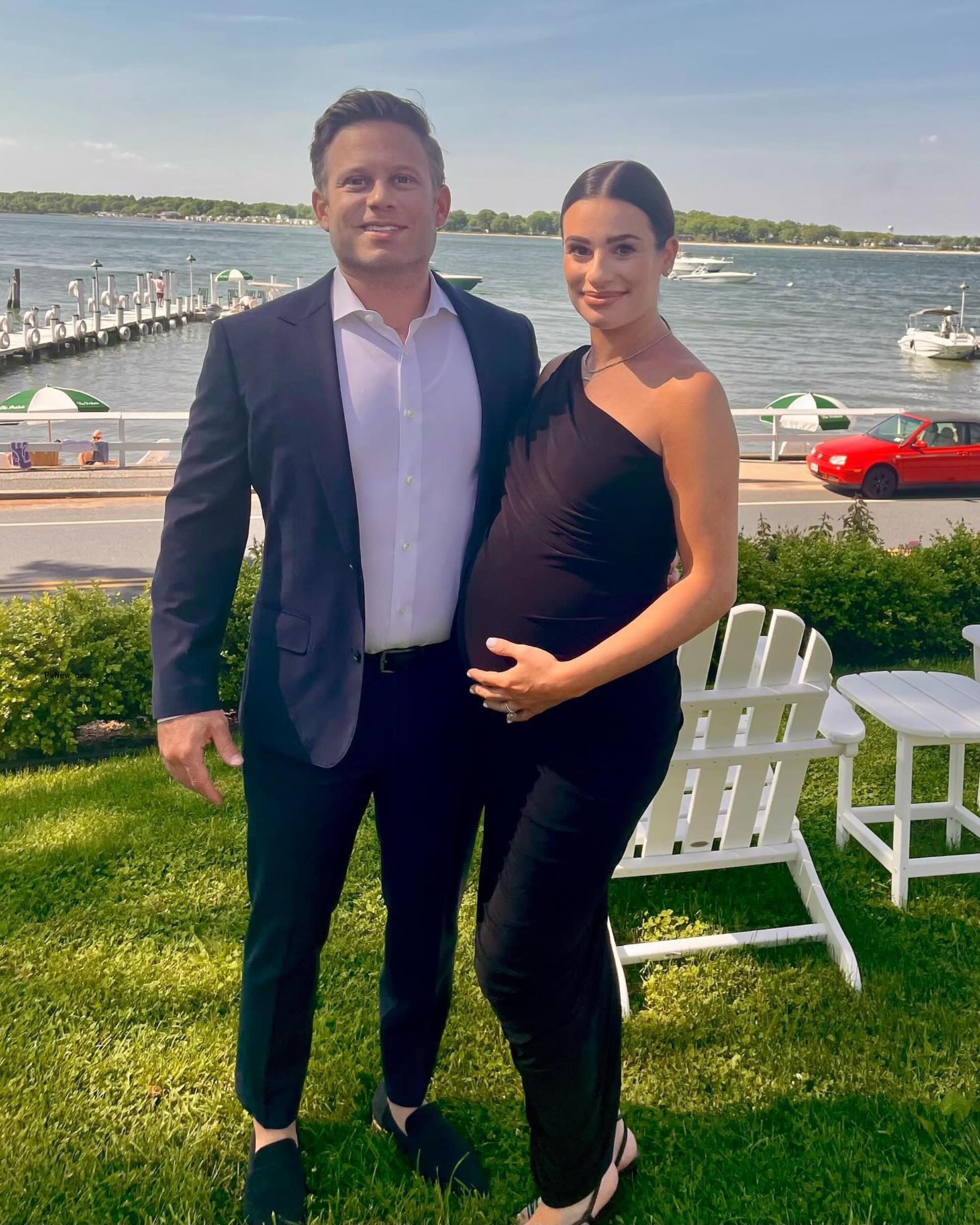 Michele cradles her baby bump in an Instagram photo with husband Zandy Reich.