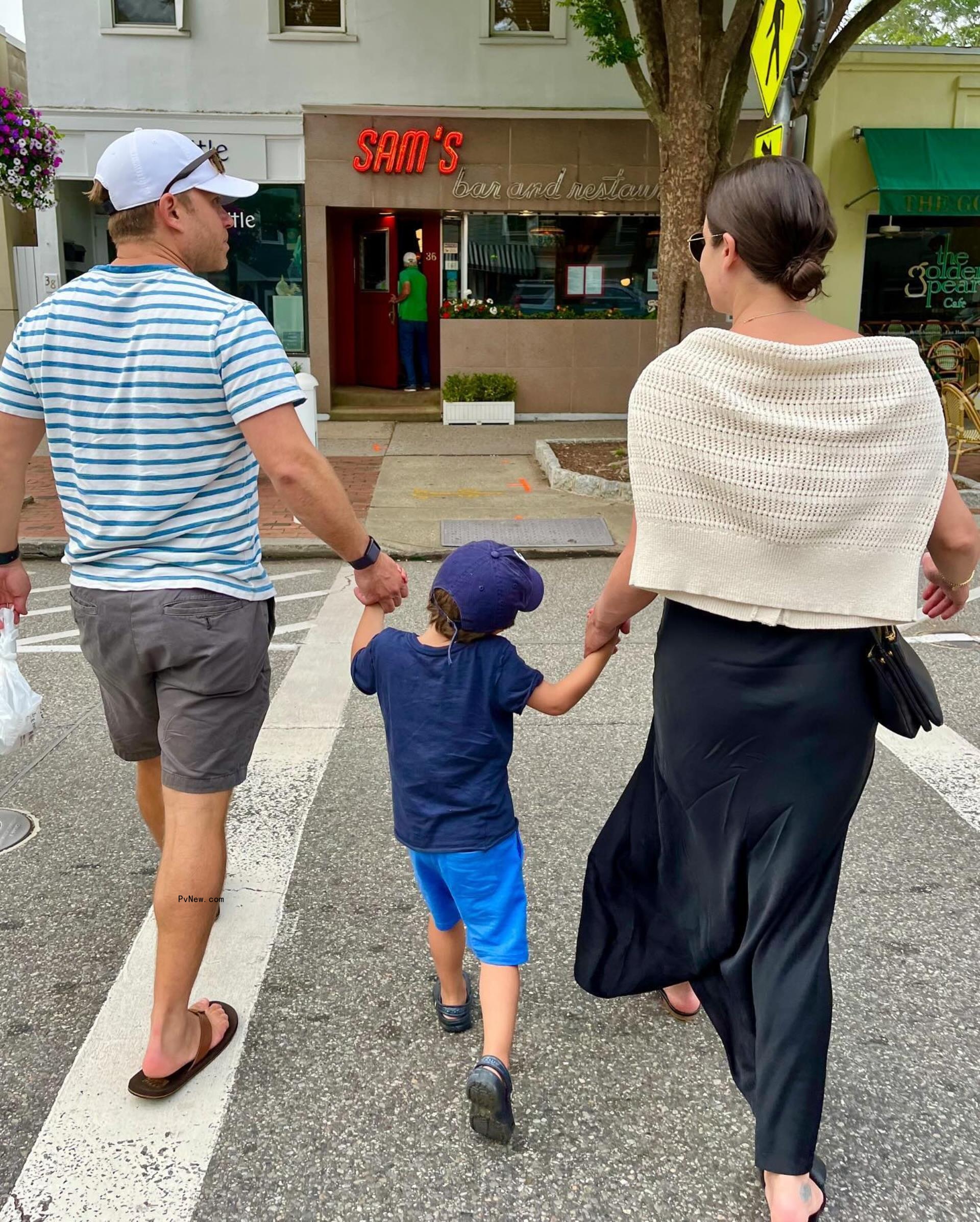 Michele and Reich hold son Ever's hands in an Instagram photo.