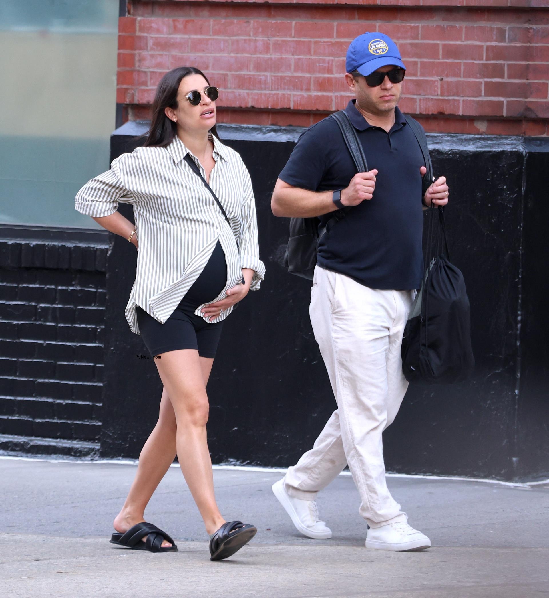 Pregnant Michele and Reich walk in New York City in June.