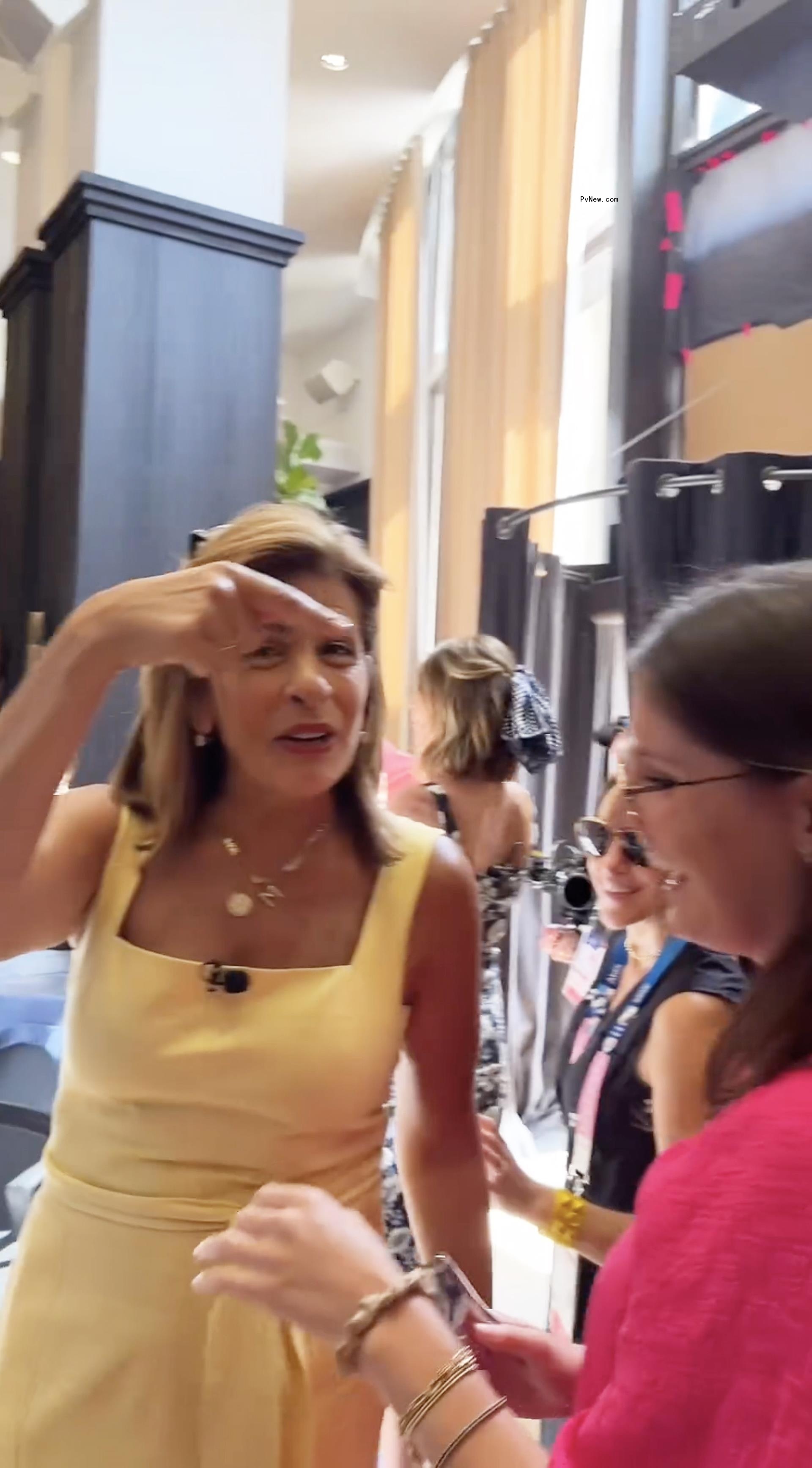 Hoda Kotb getting her yellow dress stapled together