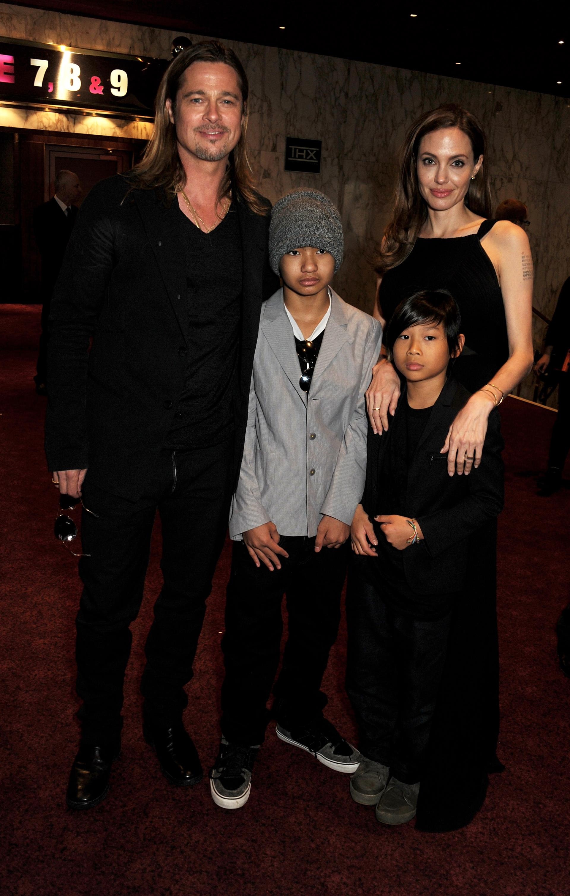 Angelina Jolie and Brad Pitt with Pax and Maddox in 2013.