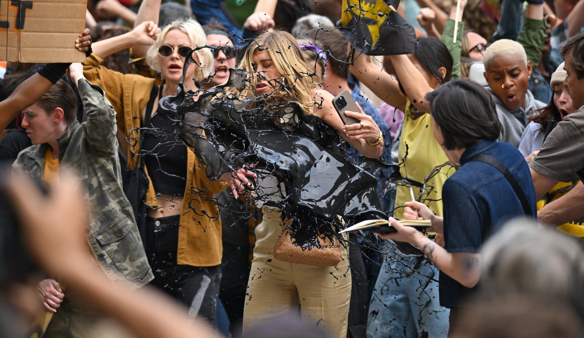 Jennifer Aniston getting fake oil thrown on her