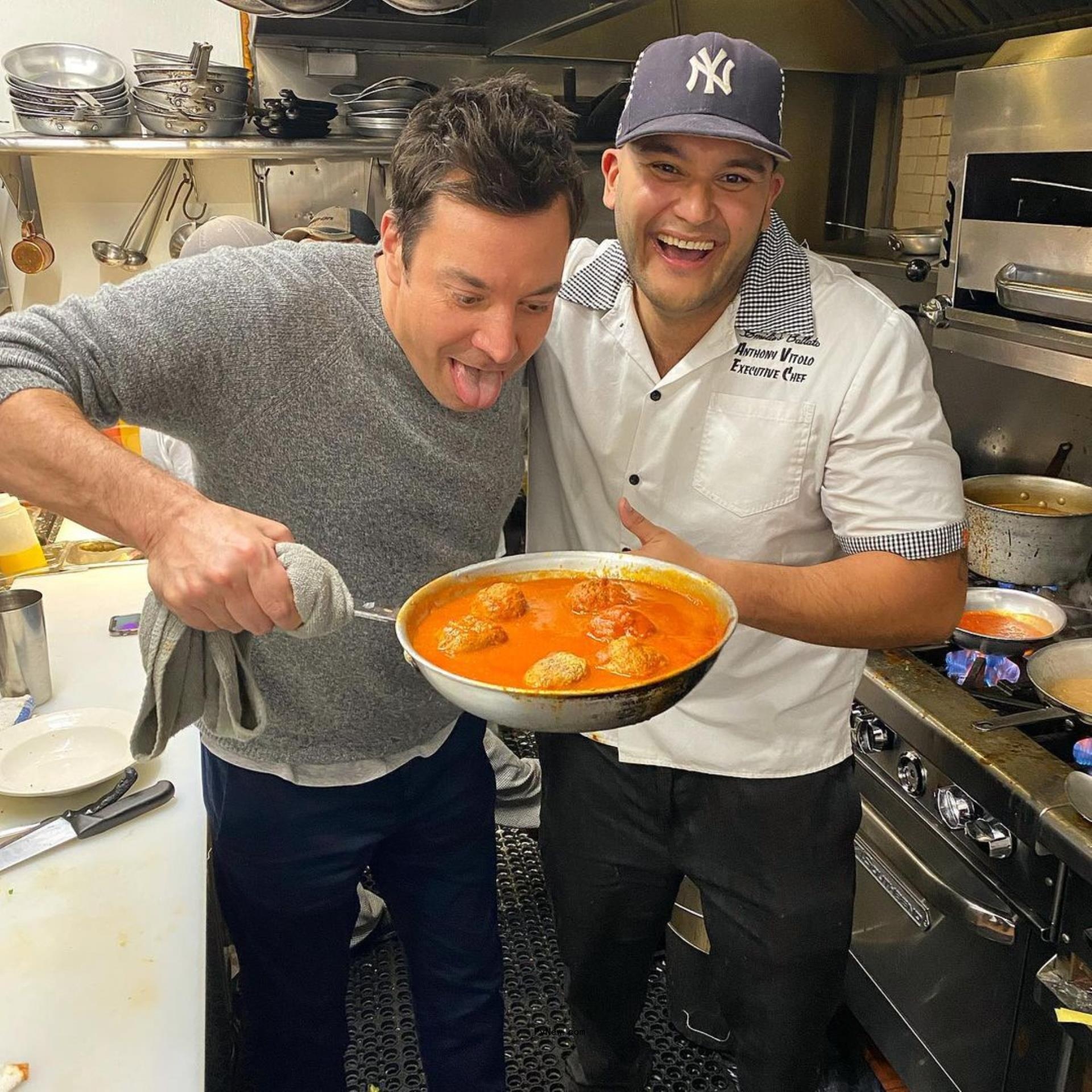 Jimmy Fallon holding meatballs with Anthony Vitolo in the kitchen of Emilio's Ballato.