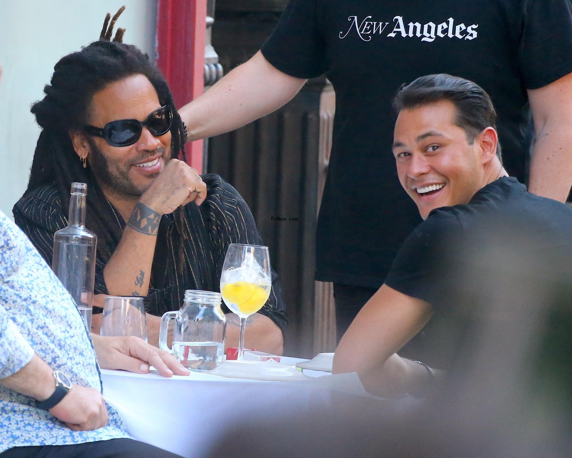 Lenny Kravitz and Emilio Vitolo Jr. eating outside of Emilio's Ballato in 2022.
