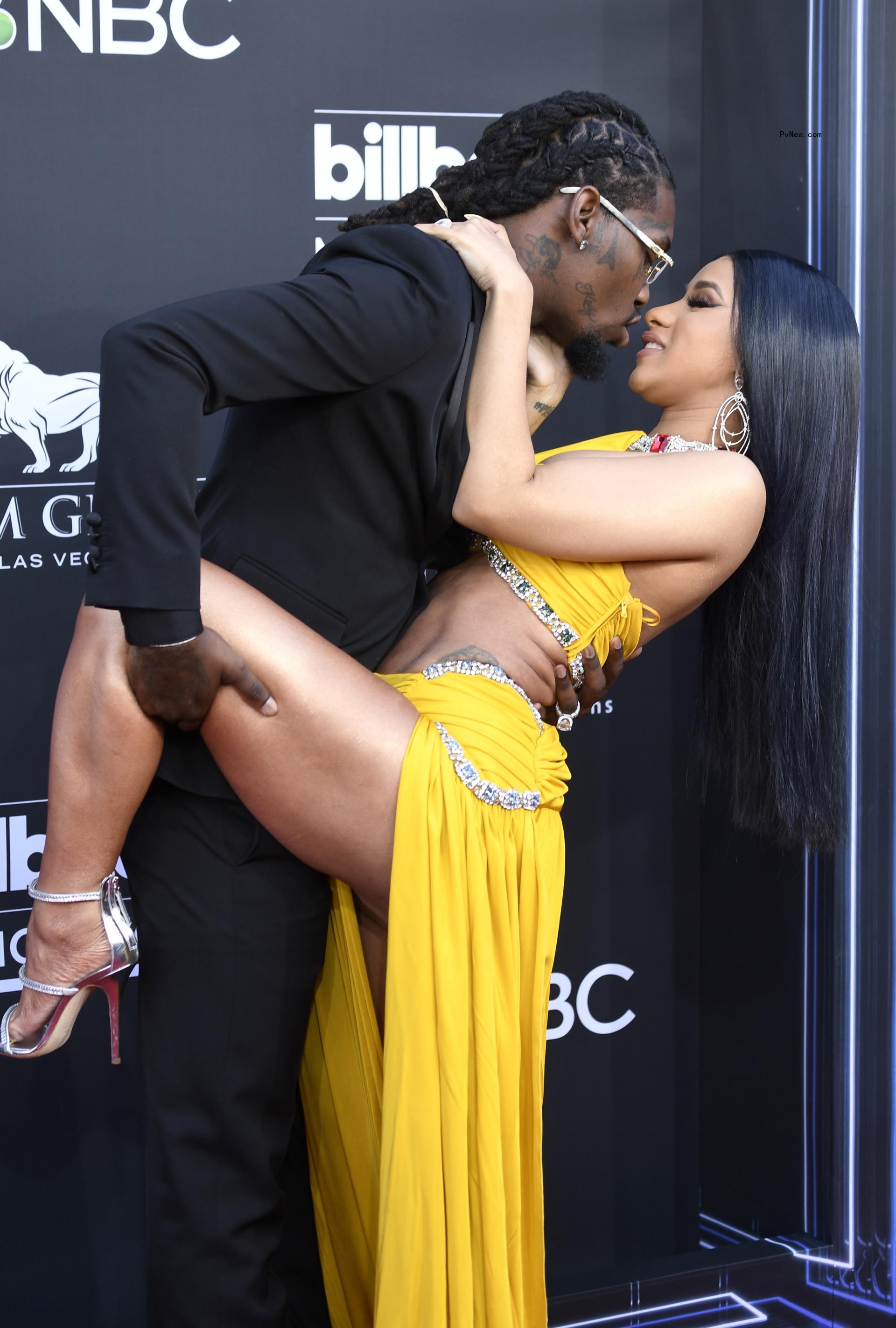 Cardi B and Offset on a red carpet in 2019.