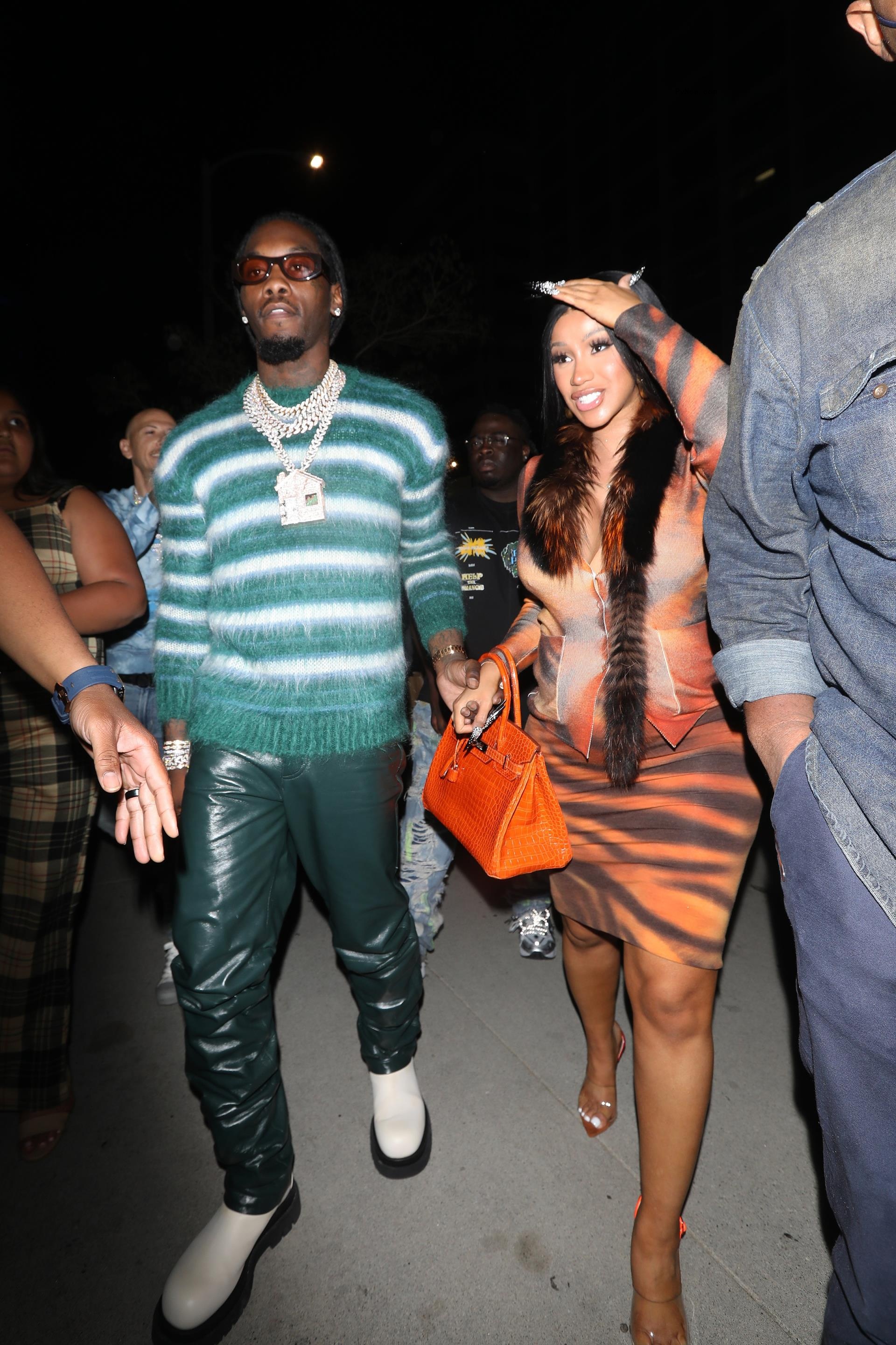 Cardi B and Offset holding hands in 2021.