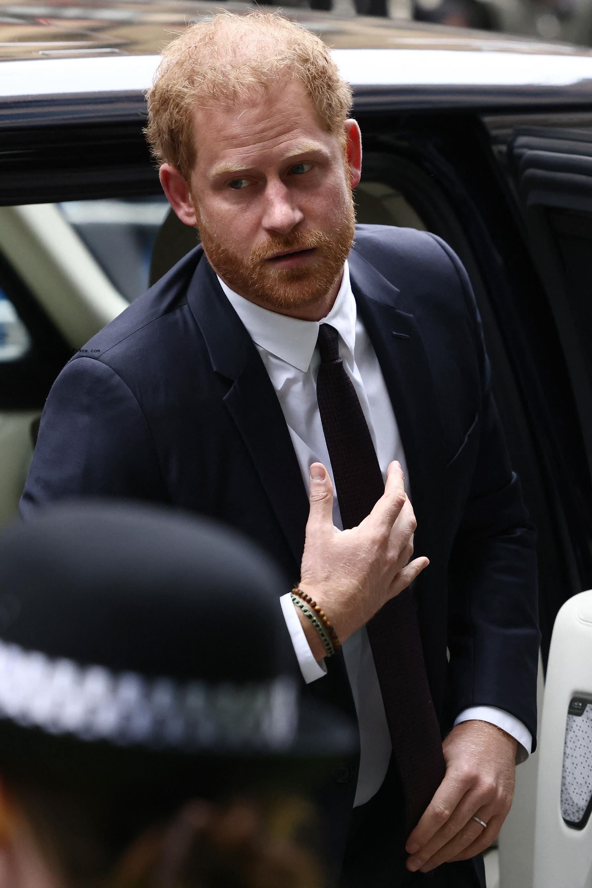Prince Harry getting out of a car in 2023.