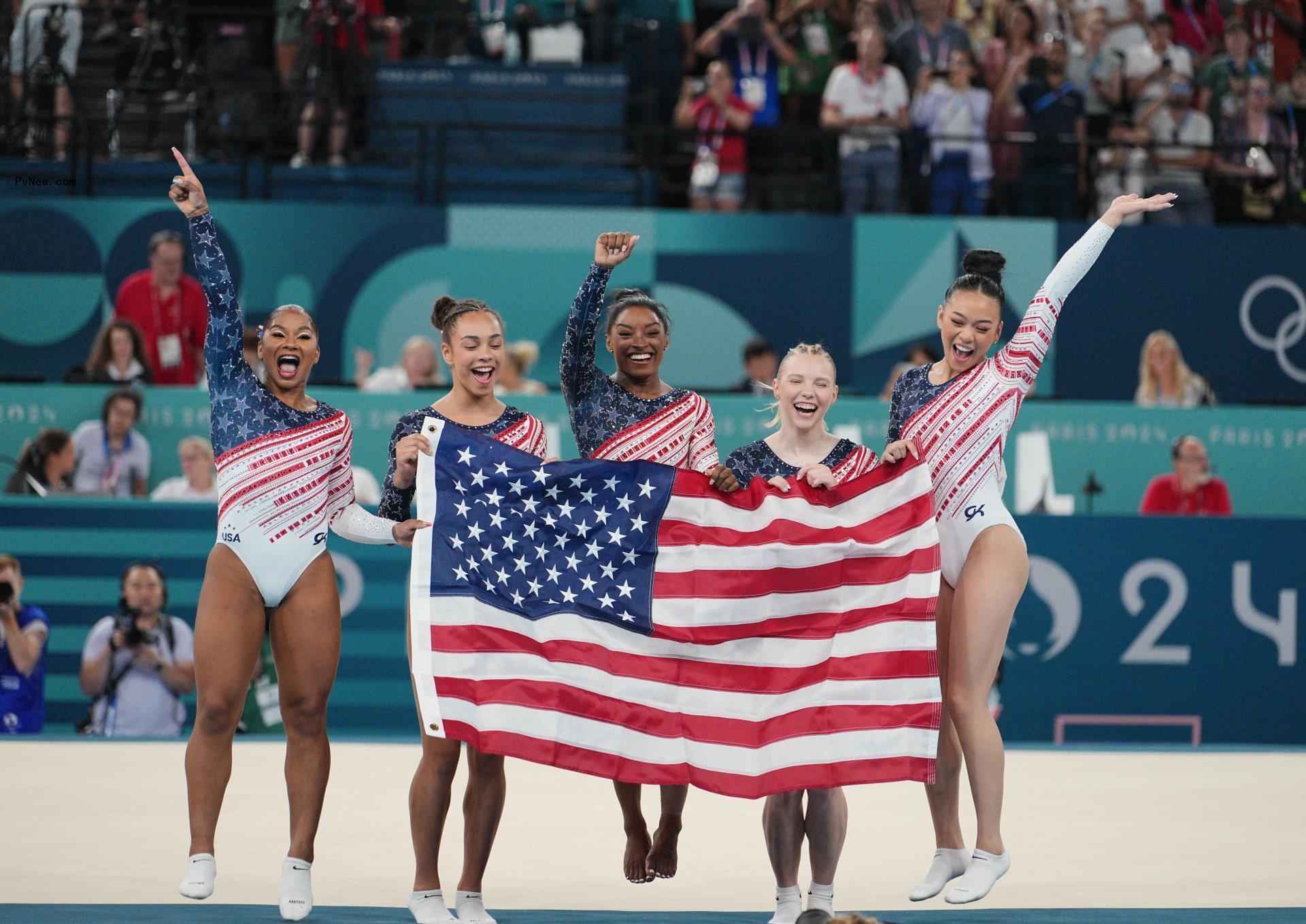 Simone Biles (L), Jade Carey (2nd L), Jordan Chiles (C), Sunisa Lee (2nd R) and Healy Rivera celebrate 2024 Paris Olympics win