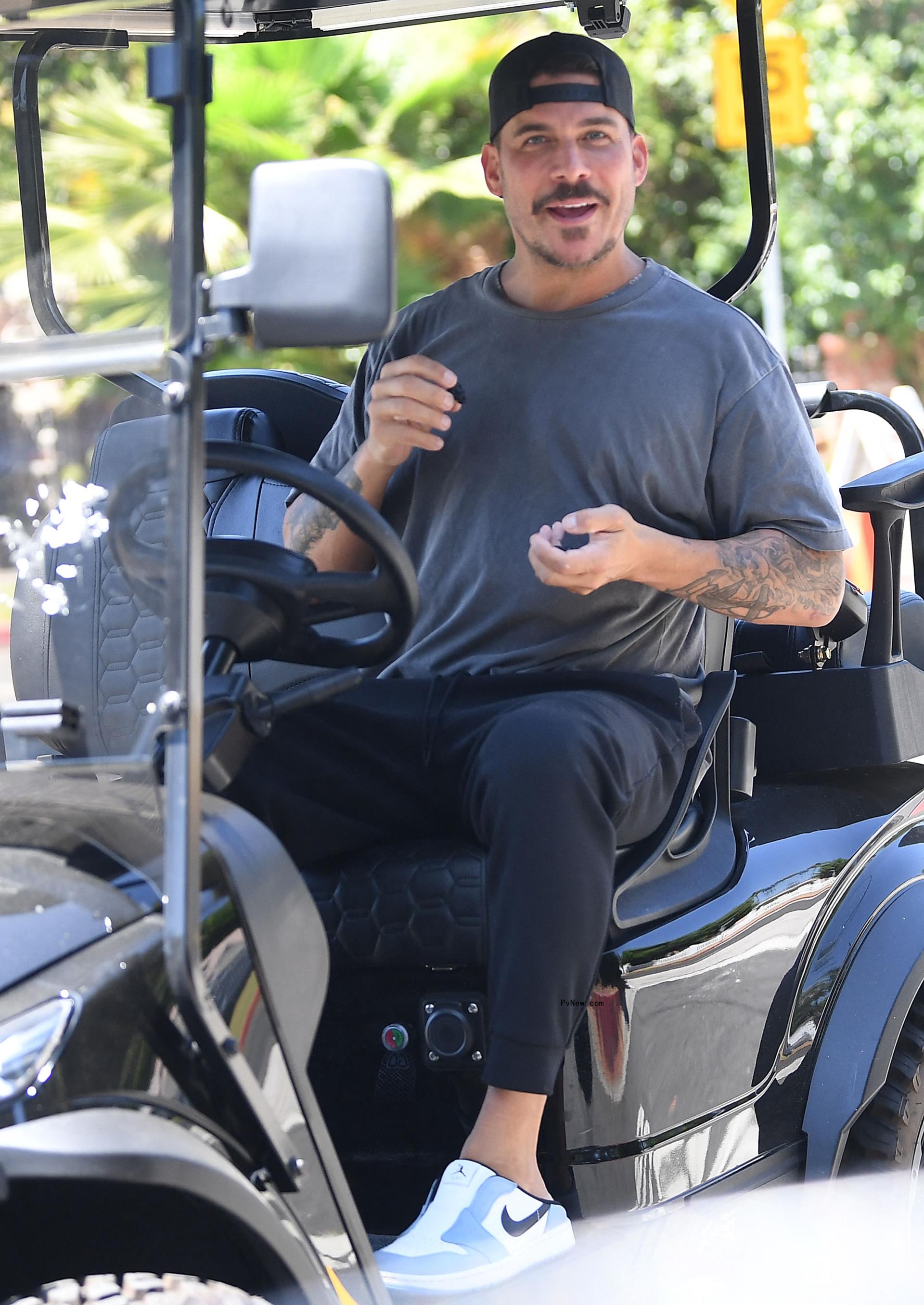 Jax Taylor on a golf cart