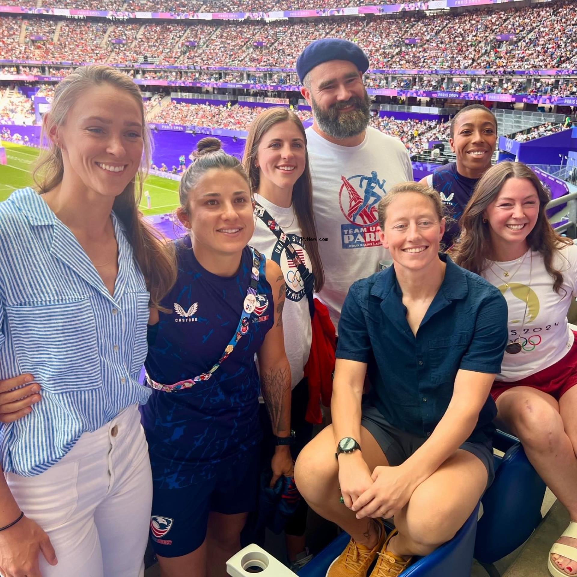 kylie and jason kelce posing with female athletes