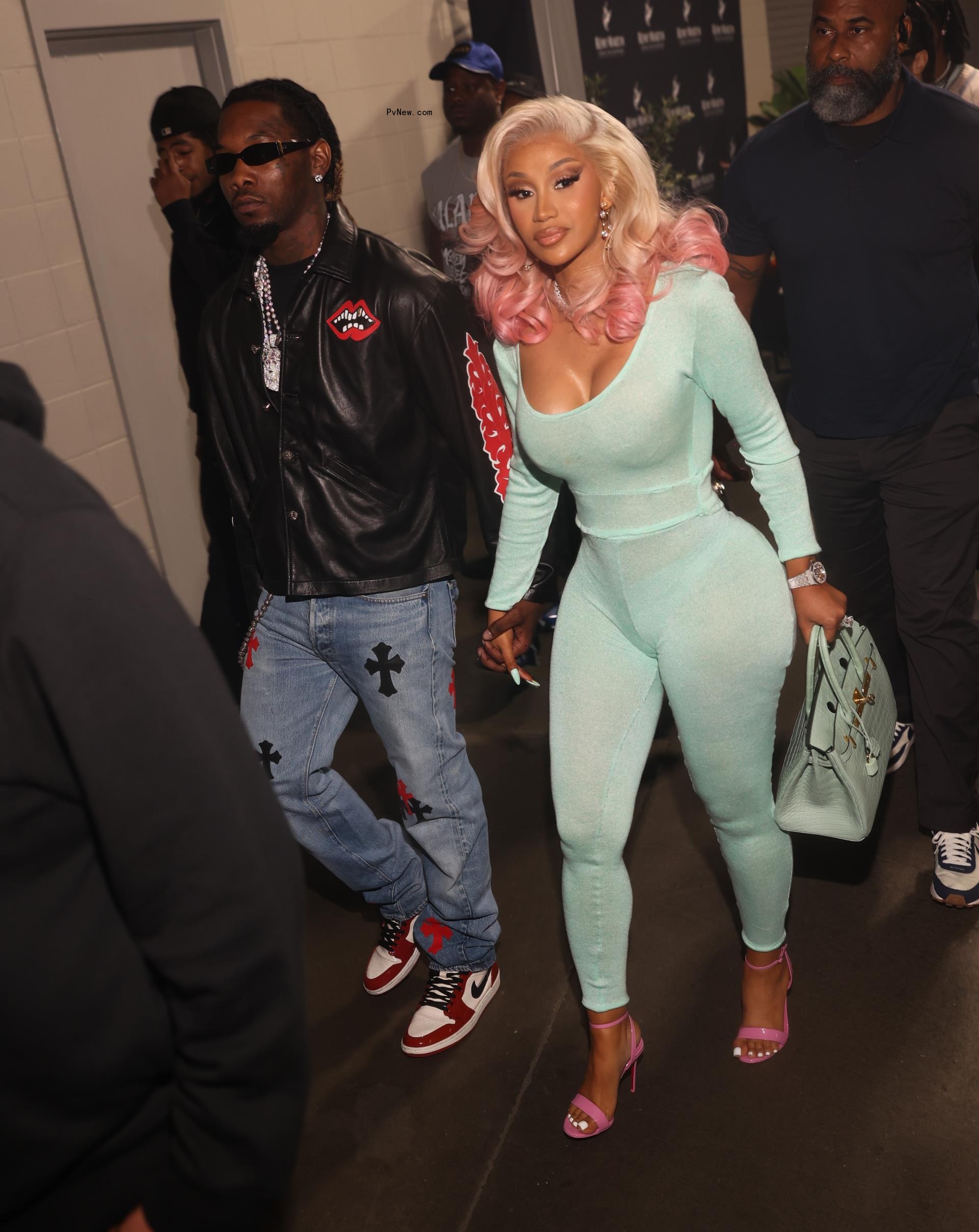 Cardi B and Offset hold hands in June 2023