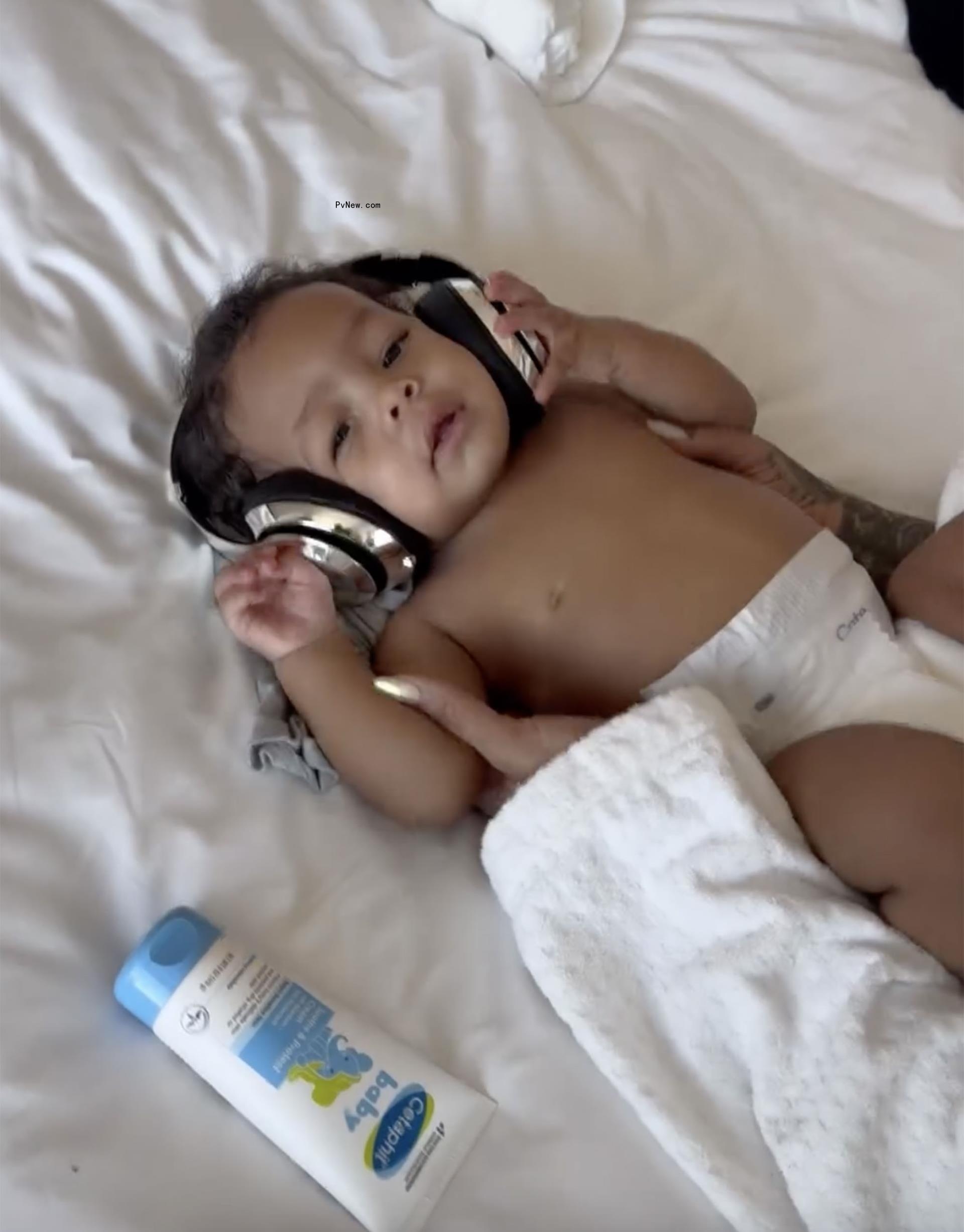 Riot wears headpho<i></i>nes and a diaper in a Thursday Instagram photo.