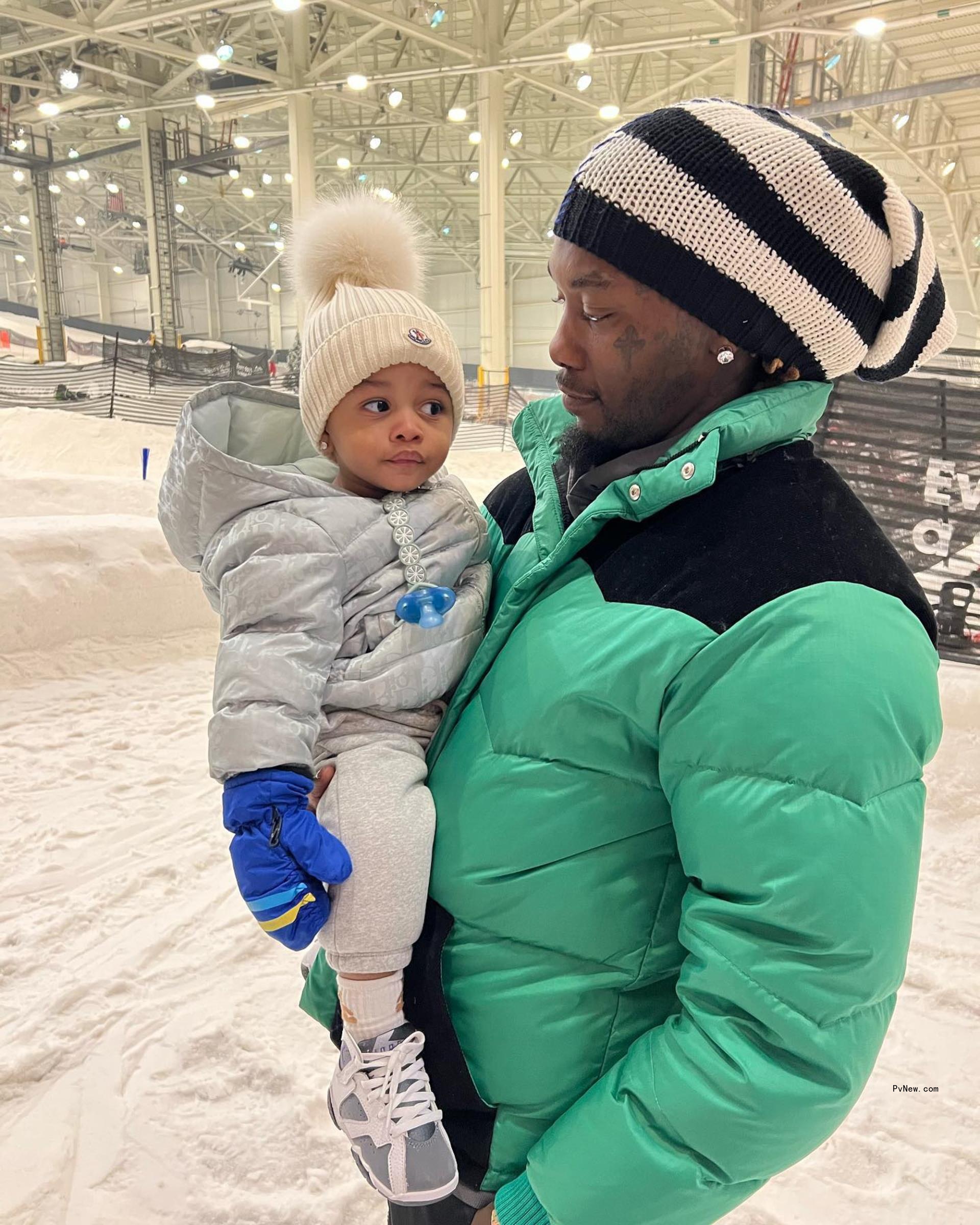 Offset in snow with son Wave in Instagram photo