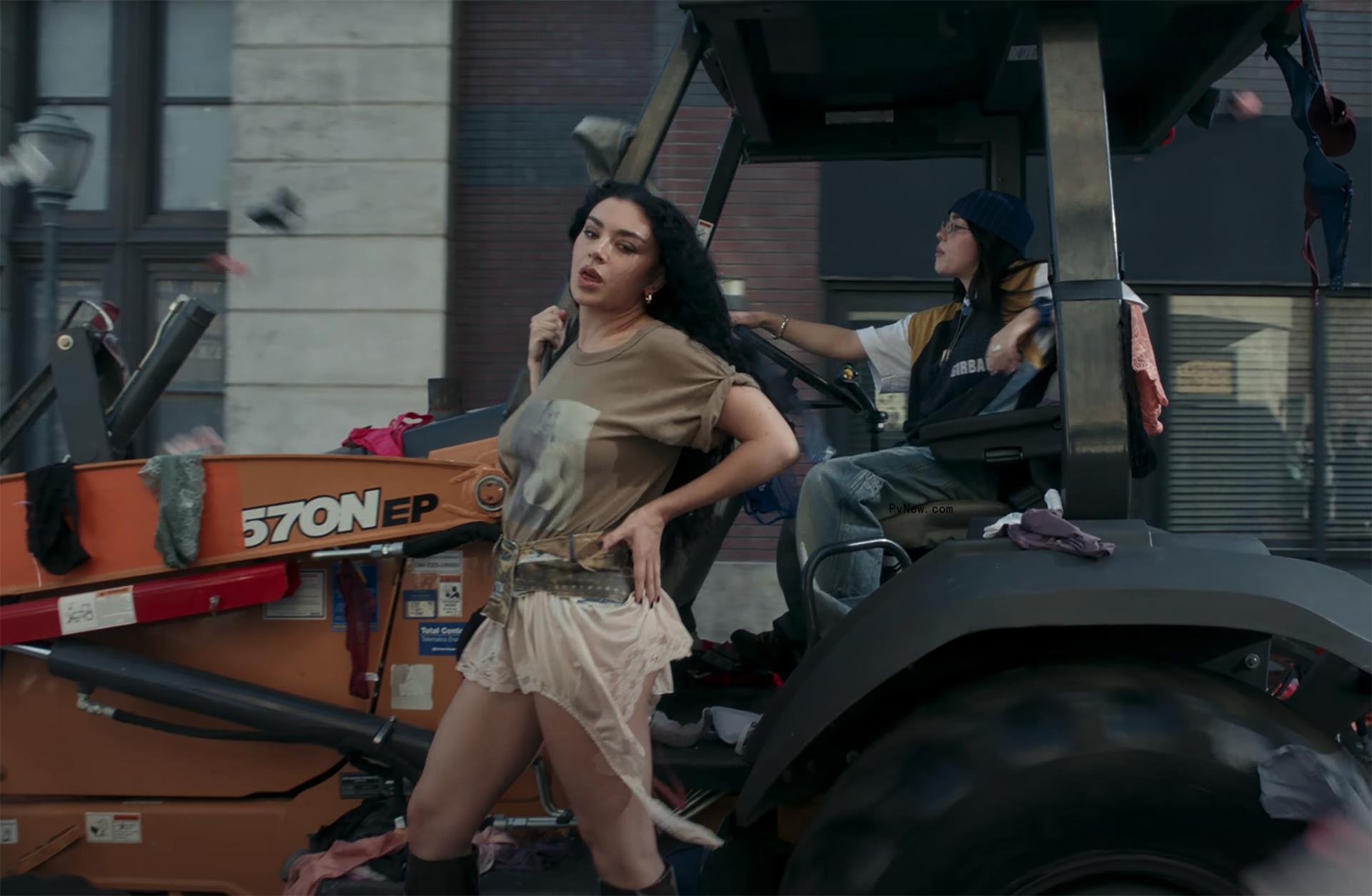 Charli XCX and Billie Eilish surrounded by underwear in the ‘Guess’ music video